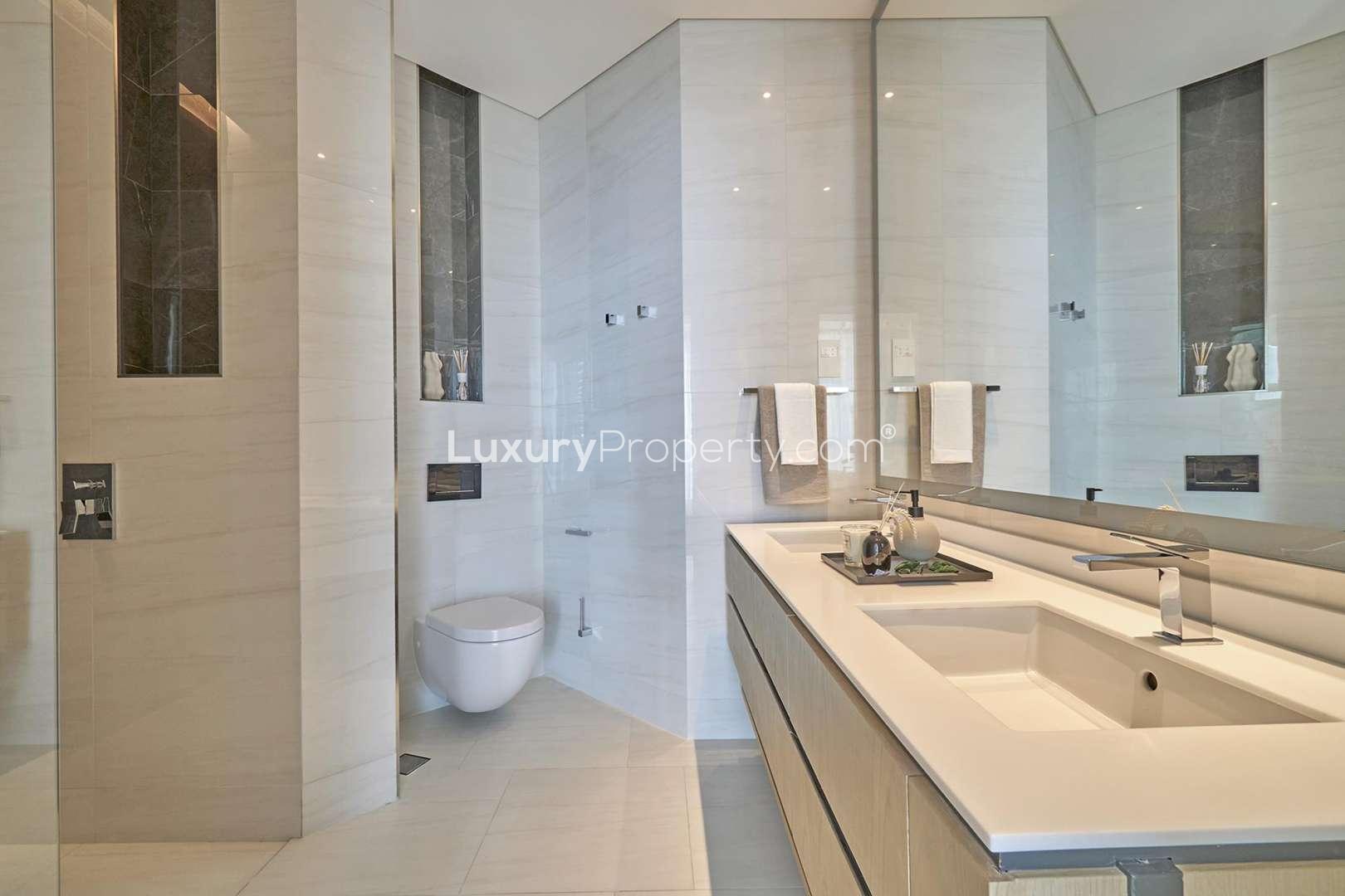 Modern kitchen and dining area in SLS Dubai Residences studio apartment for sale