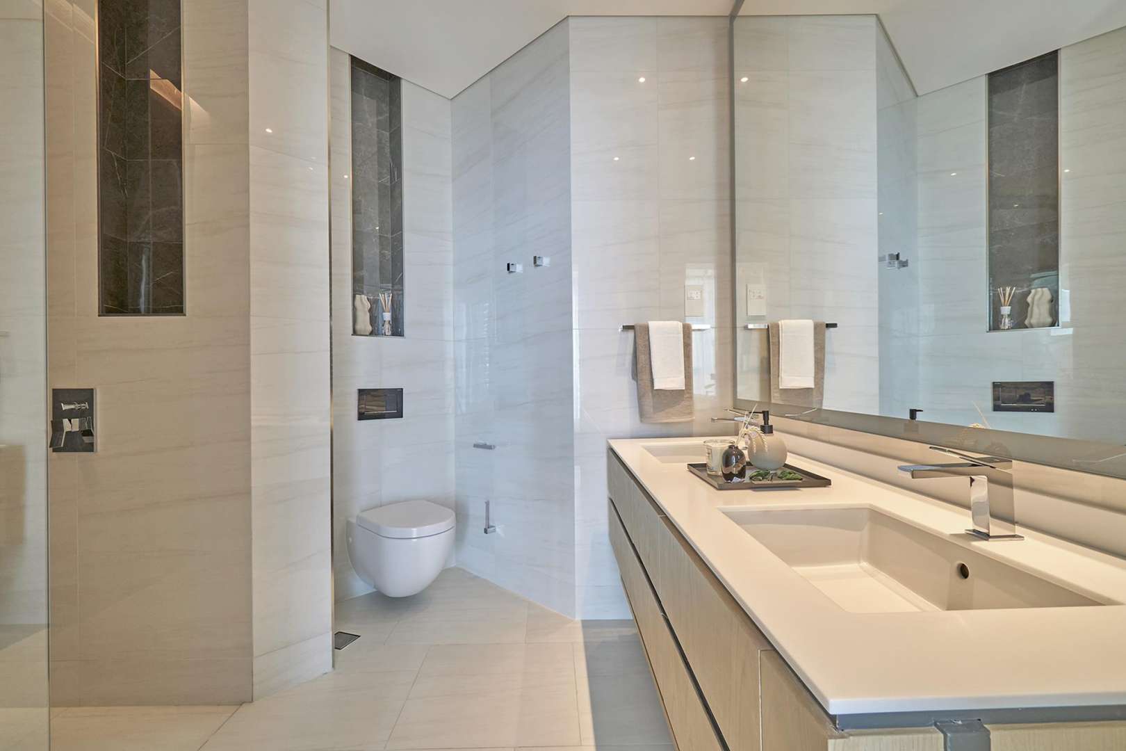 Modern kitchen and dining area in SLS Dubai Residences studio apartment for sale