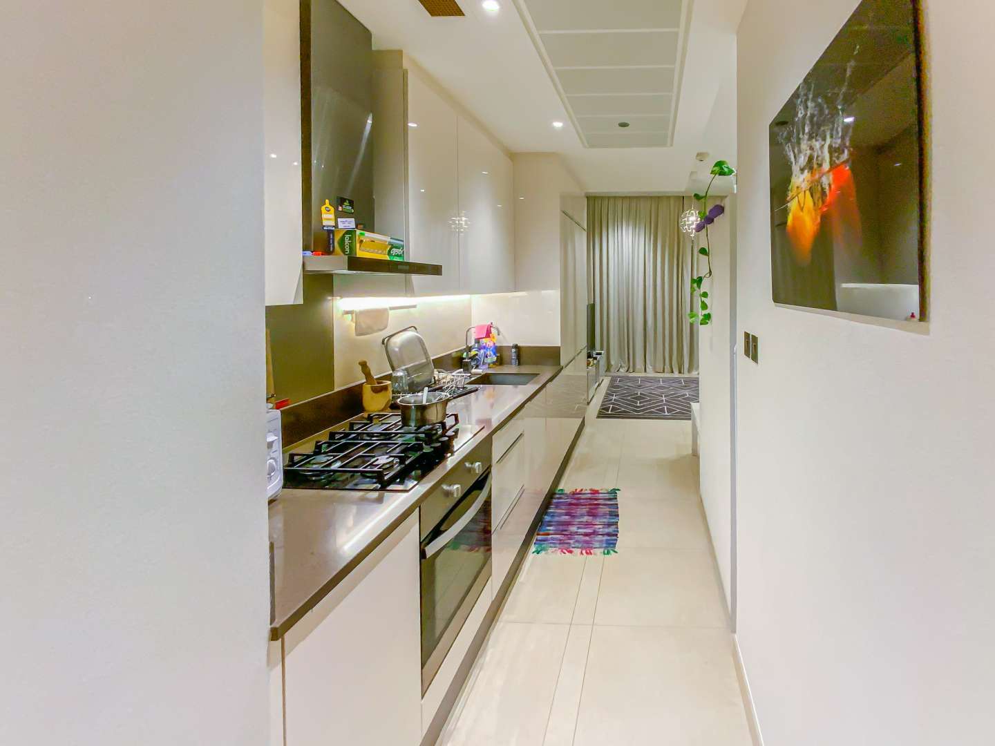 Furnished living area in studio apartment, Marina Gate, Dubai Marina, with modern decor and TV