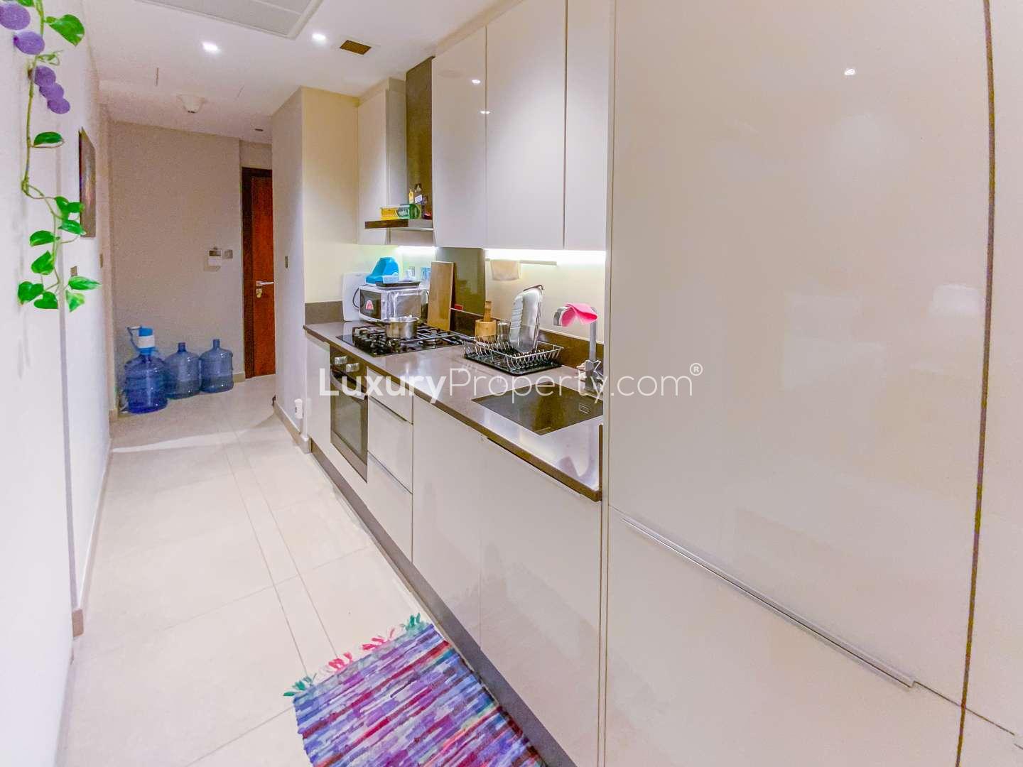Furnished kitchen in studio apartment at Marina Gate, Dubai Marina, available for short-term rent