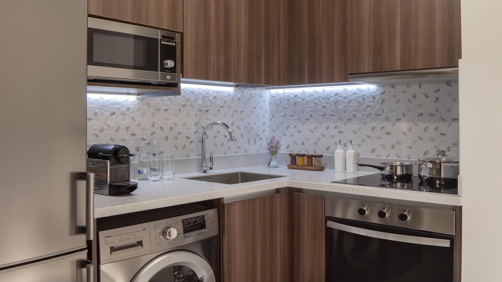 Furnished studio apartment interior at Avani Palm View, Dubai Media City, with modern decor