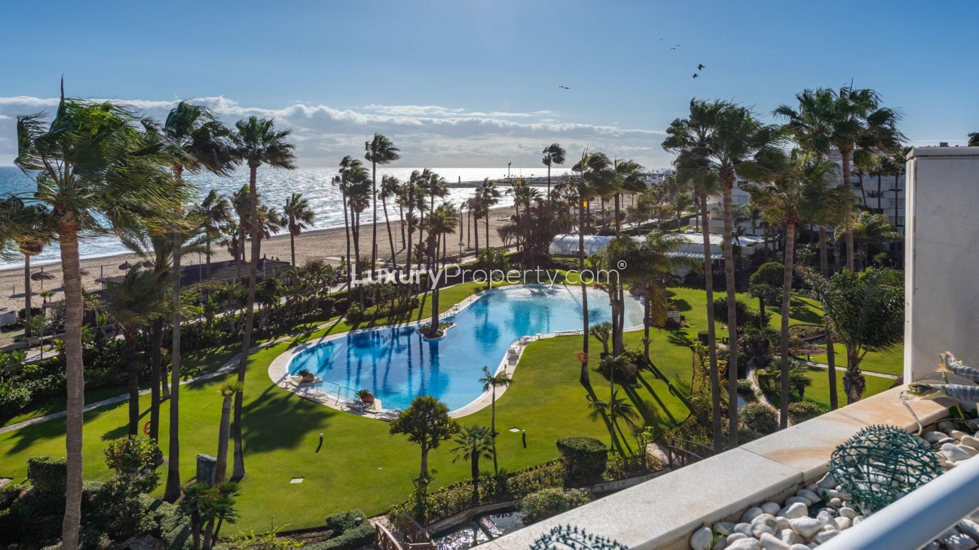 Sea view from penthouse in Marbella, overlooking pool and beach in Puerto Banús