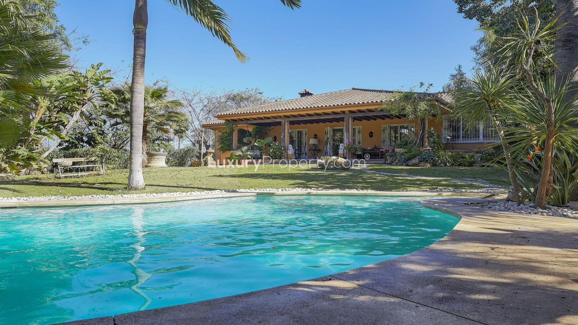 Luxurious villa with pool in Atalaya de Río Verde, Marbella, surrounded by lush greenery