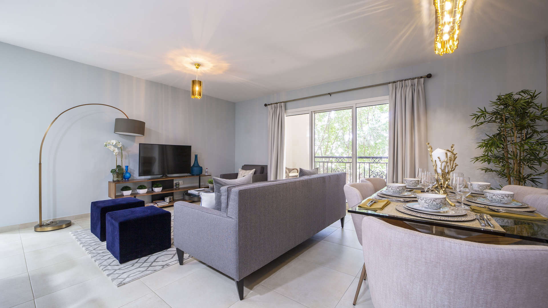 Modern studio apartment interior in Al Andalus, Jumeirah Golf Estates, featuring open kitchen and lounge