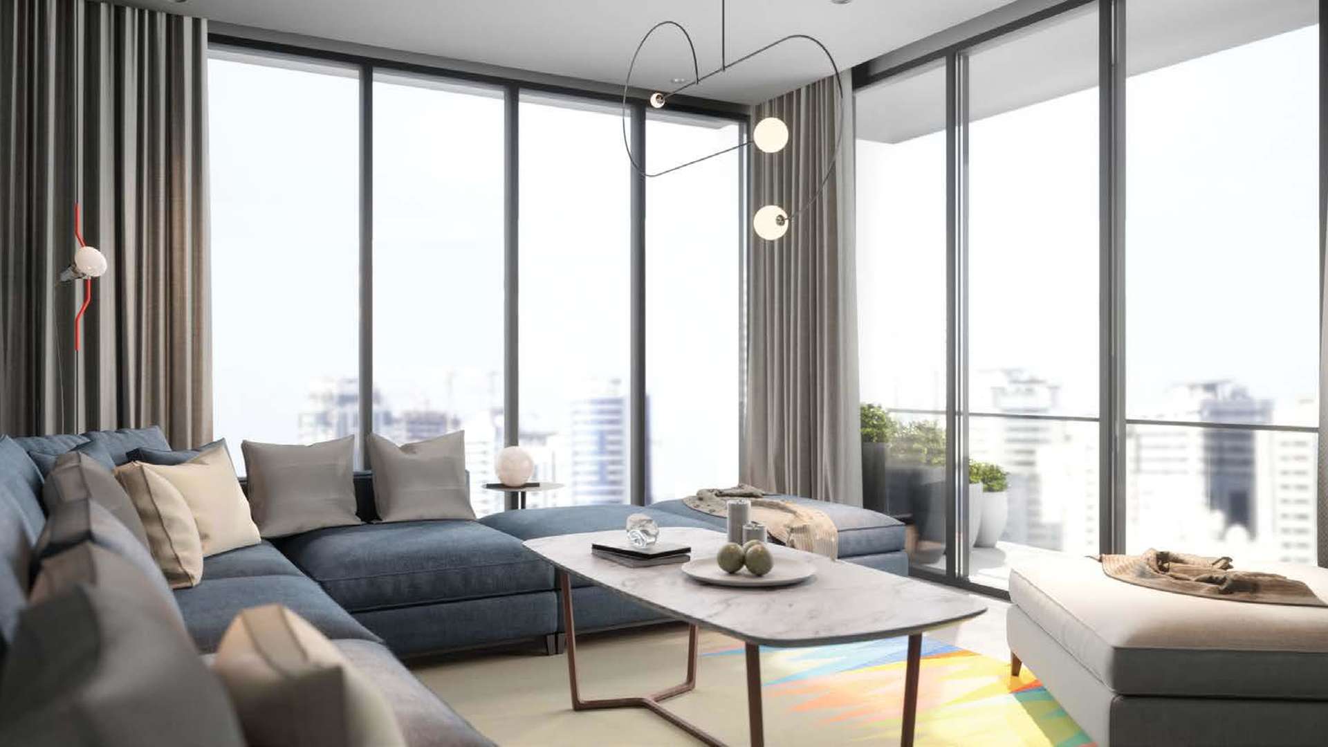 Modern living room in Areej apartment, Aljada, Sharjah with large windows and stylish decor