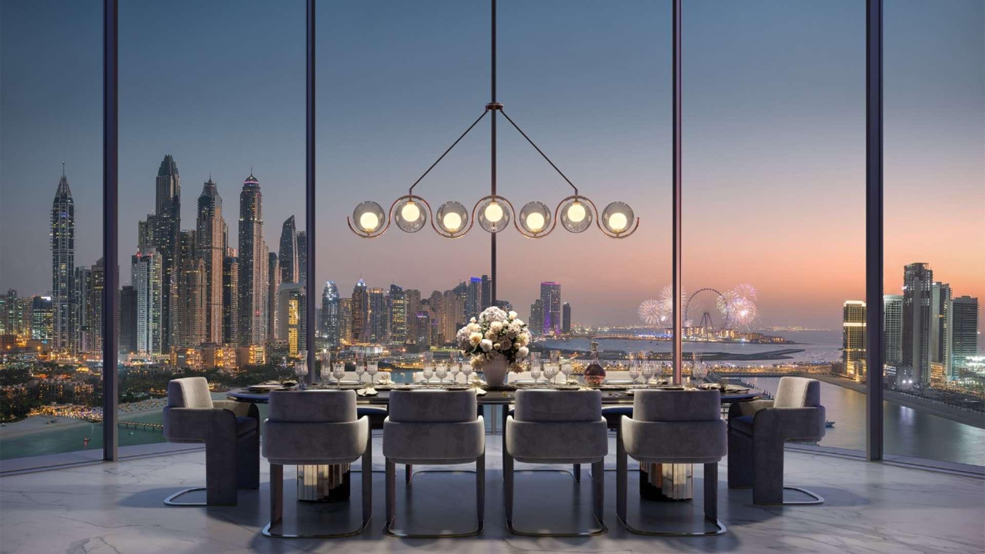 Luxurious terrace view from Ava At Palm Jumeirah apartment, overlooking Dubai skyline and sea
