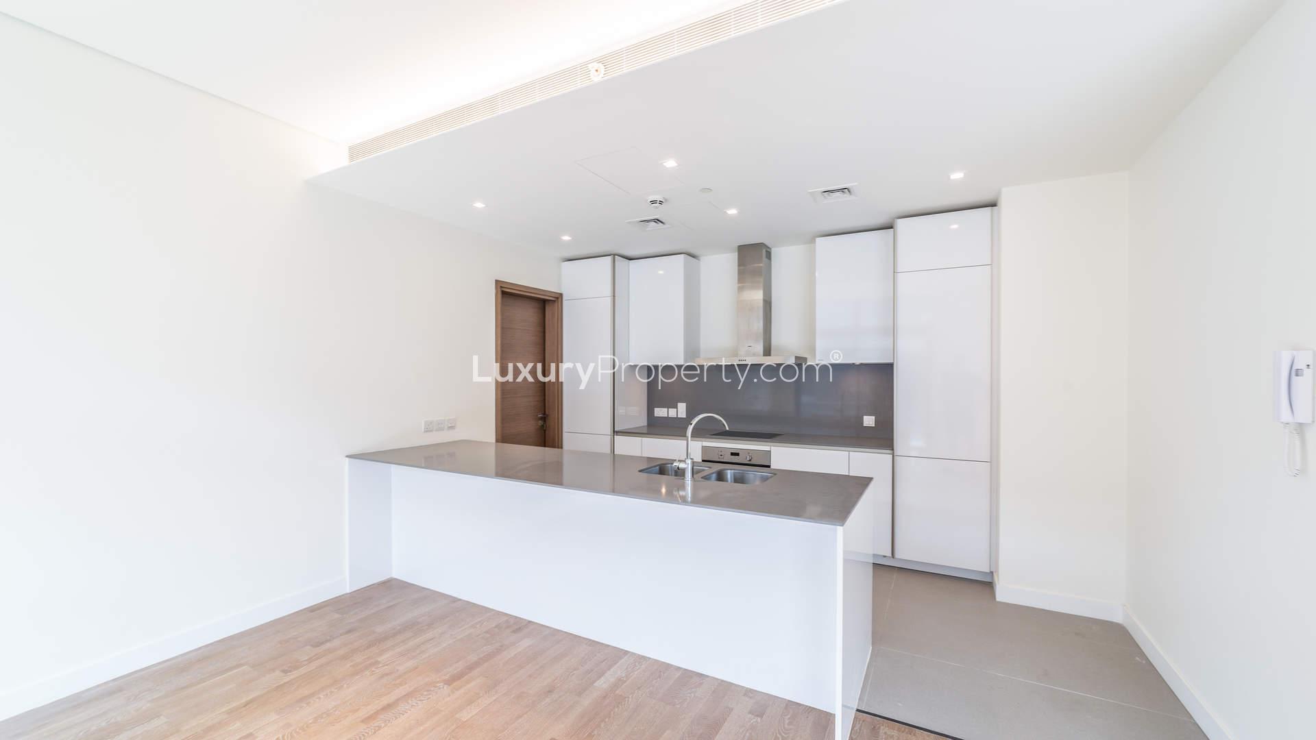"Spacious balcony view of modern City Walk apartment for sale in Jumeirah by Meraas.",Ultramodern kitchen in luxury studio apartment at City Walk, Jumeirah, for sale