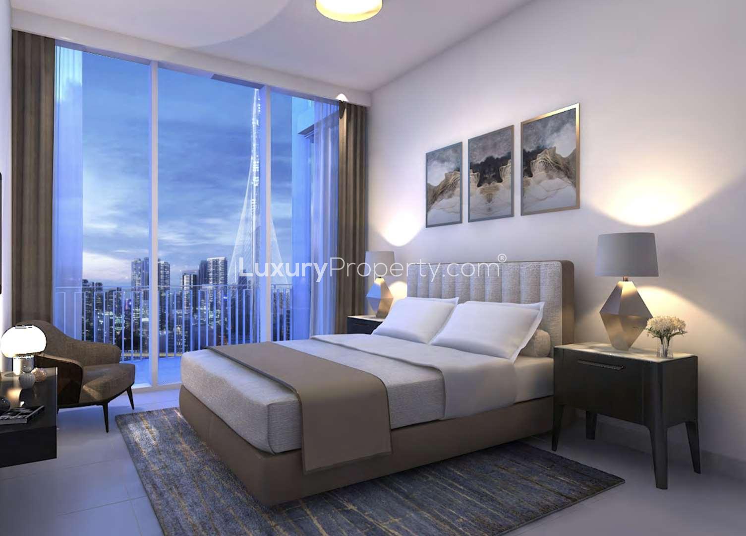 Modern kitchen interior in luxury Creek Gate apartment, Dubai Creek Harbour, with elegant dining setup