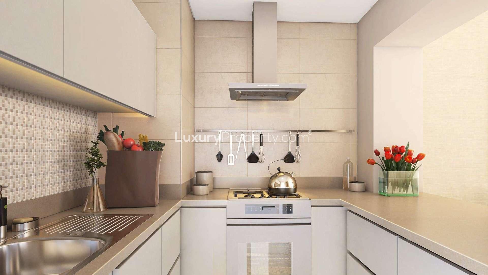 Modern living room in Genesis Apartments, Arjan, with stylish decor and large windows