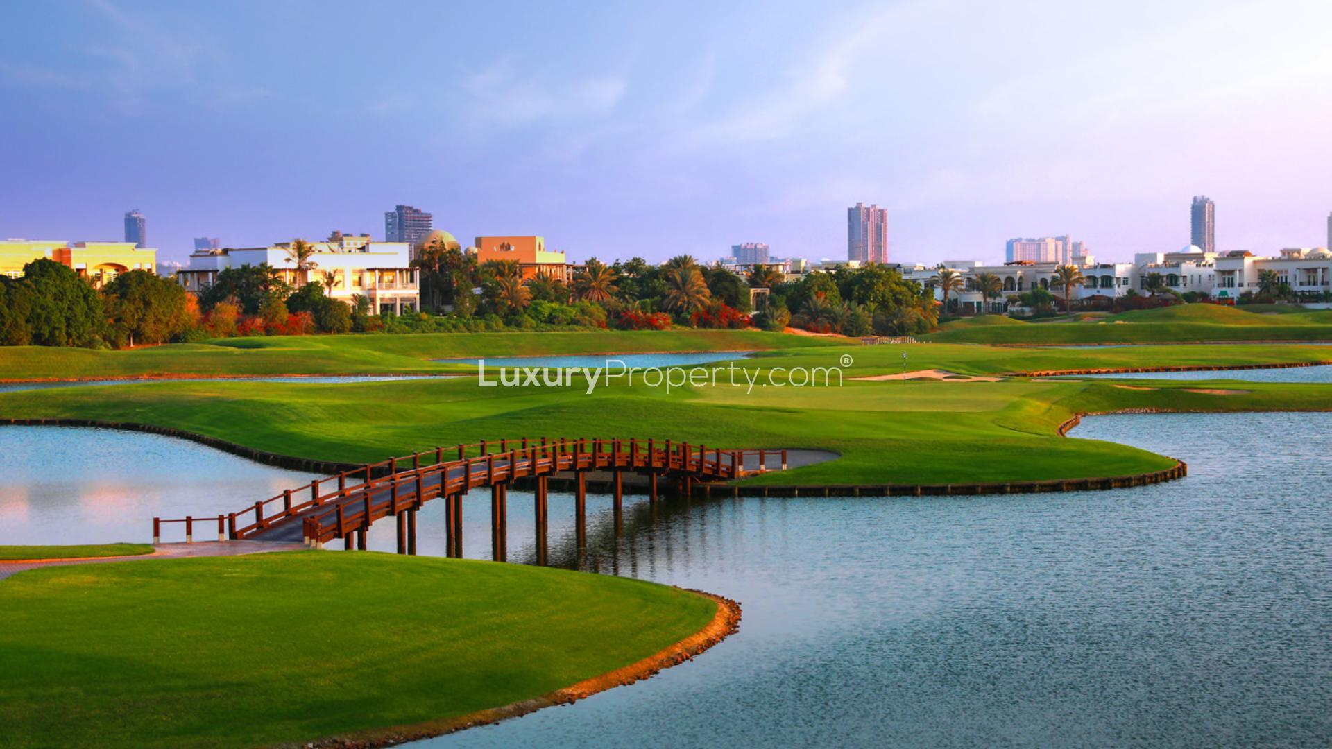 Modern lobby of Golf Heights apartment in Emirates Living, featuring elegant decor and seating