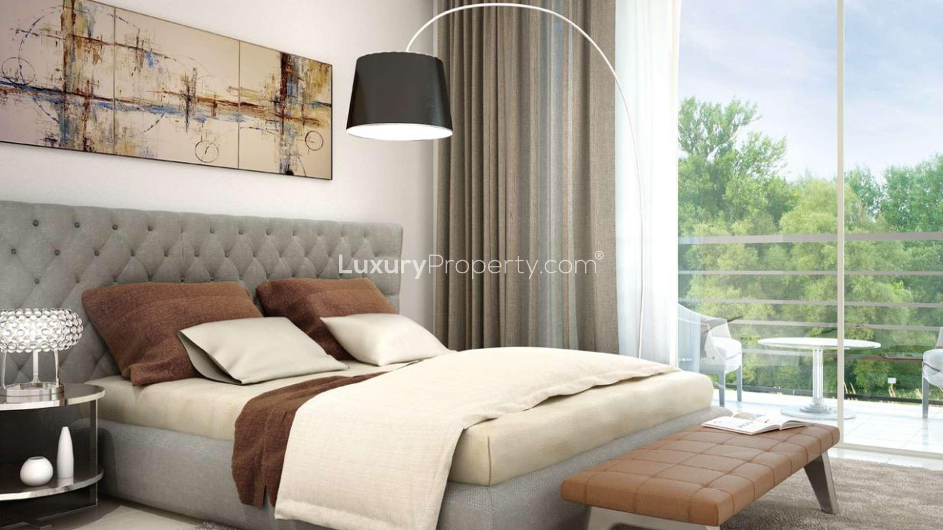 Modern living room and balcony in Hayat Boulevard apartment, Town Square, Dubai