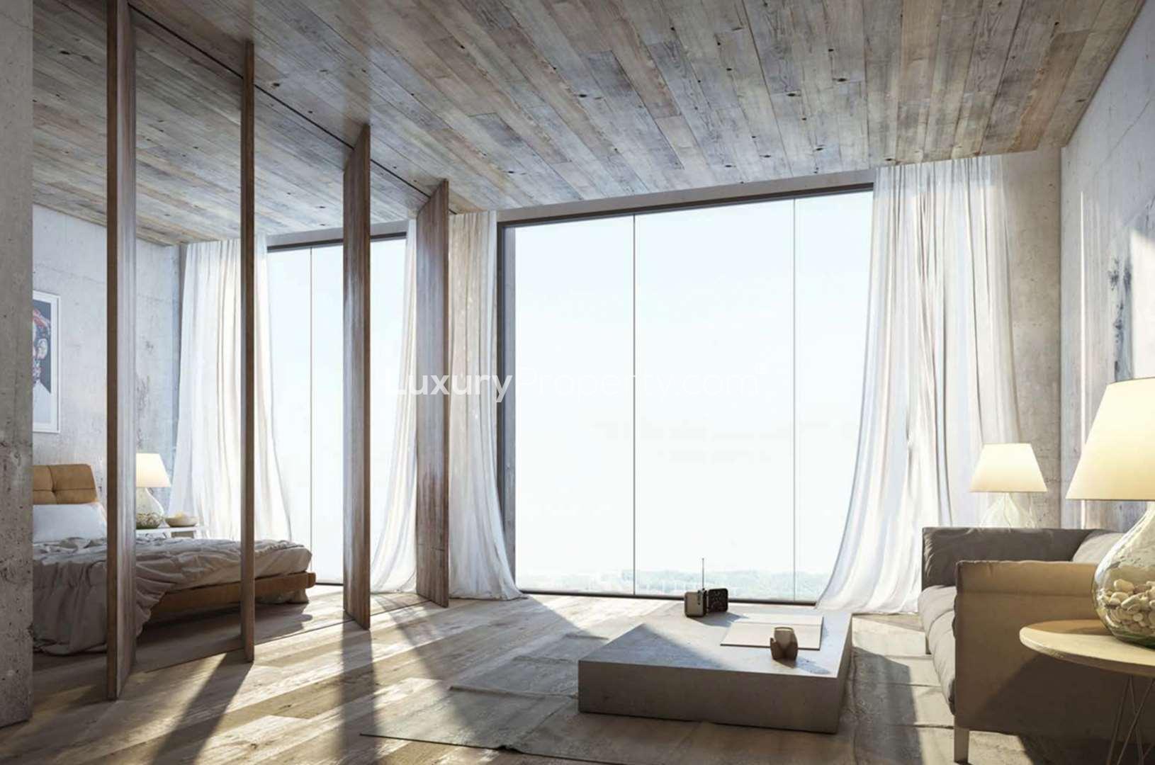 Aerial view of KOA Canvas luxury apartments in Al Barari, Dubai amidst lush greenery