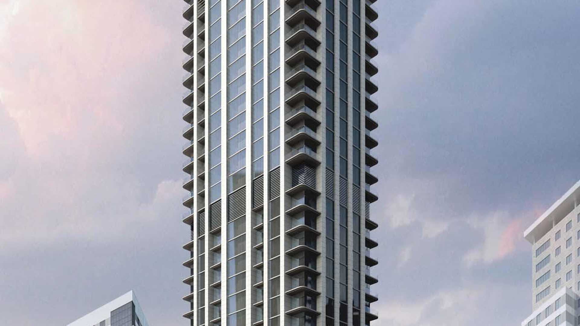 "Luxury studio apartment interior with modern staircase in Dubai Marina for sale.",Luxury high-rise apartment building in Dubai Marina, No.9 development, for sale