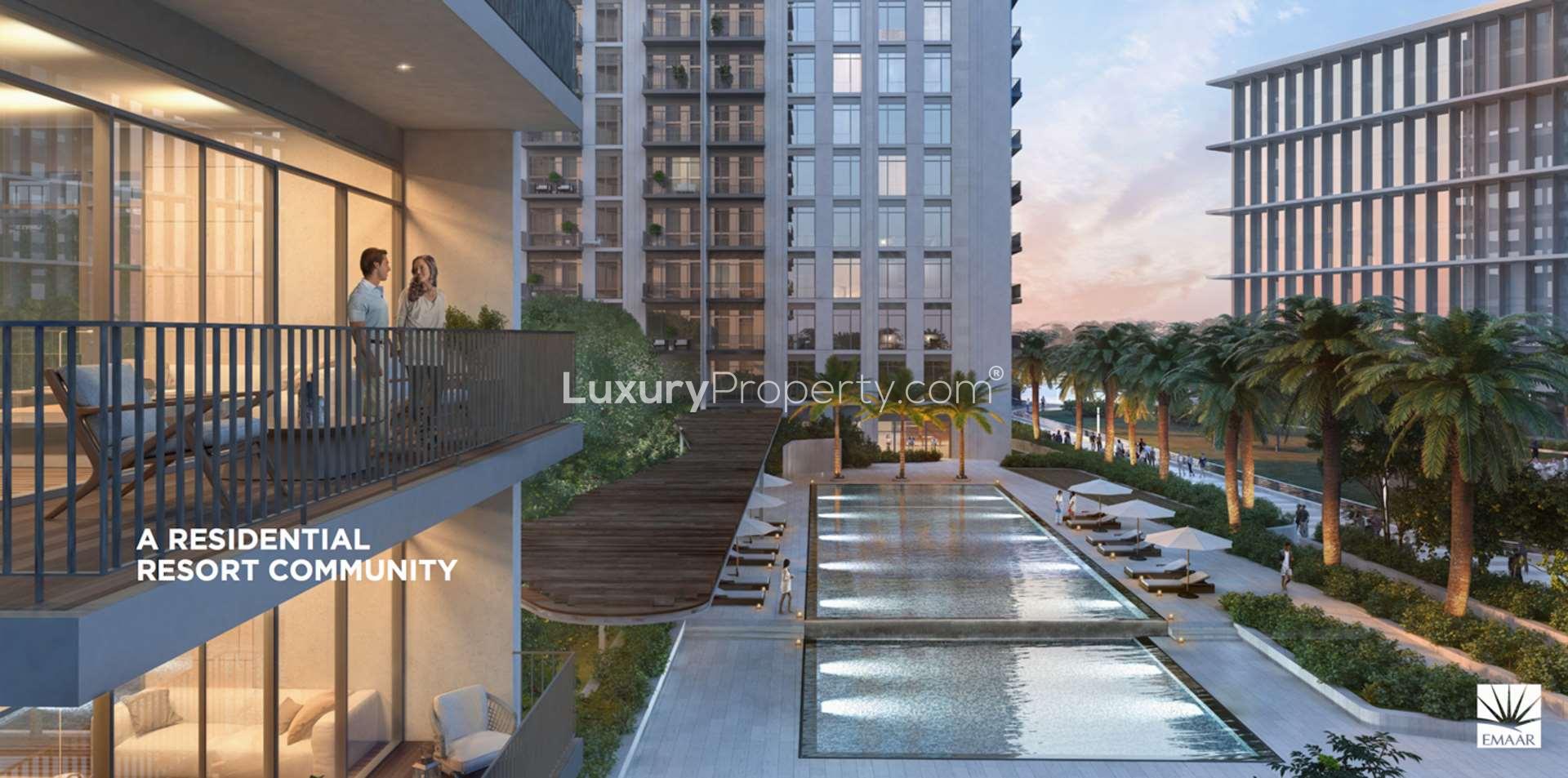 Indoor gym overlooking outdoor pool at Park Heights, Dubai Hills Estate apartment for sale