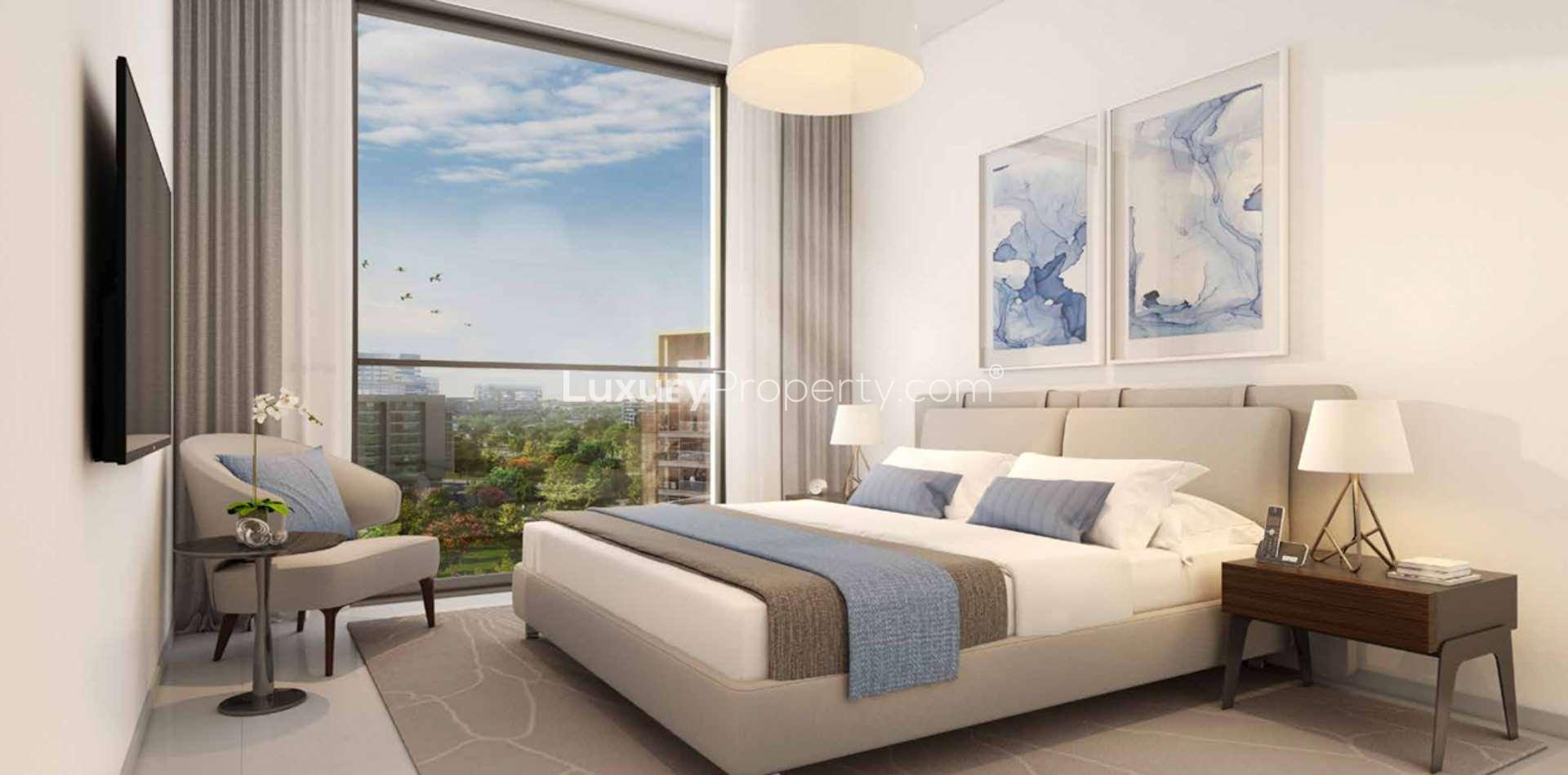 "Park Point luxury apartment exterior at dusk, Dubai Hills Estate vibrant community view.",Luxurious studio apartment interior at Park Point, Dubai Hills Estate, with scenic window view