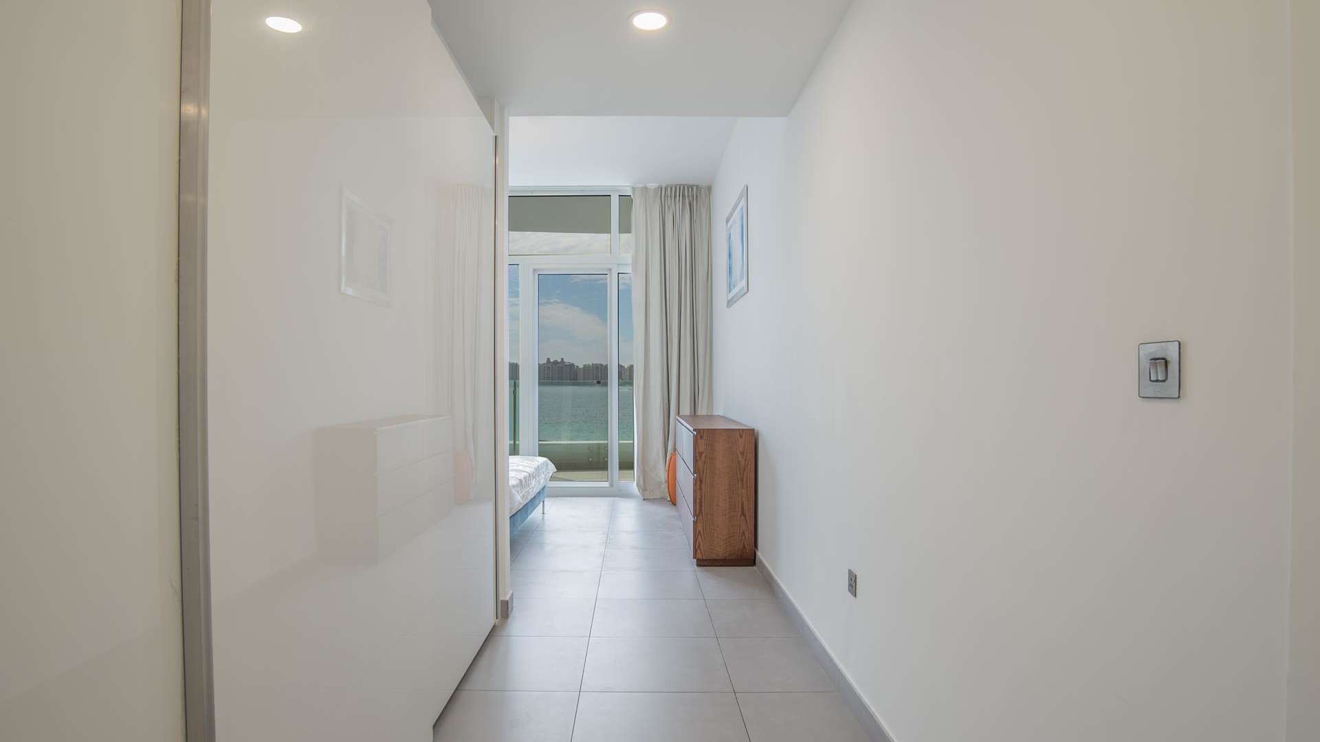 Modern kitchen in Royal Bay studio apartment, Palm Jumeirah, with sleek countertops and appliances