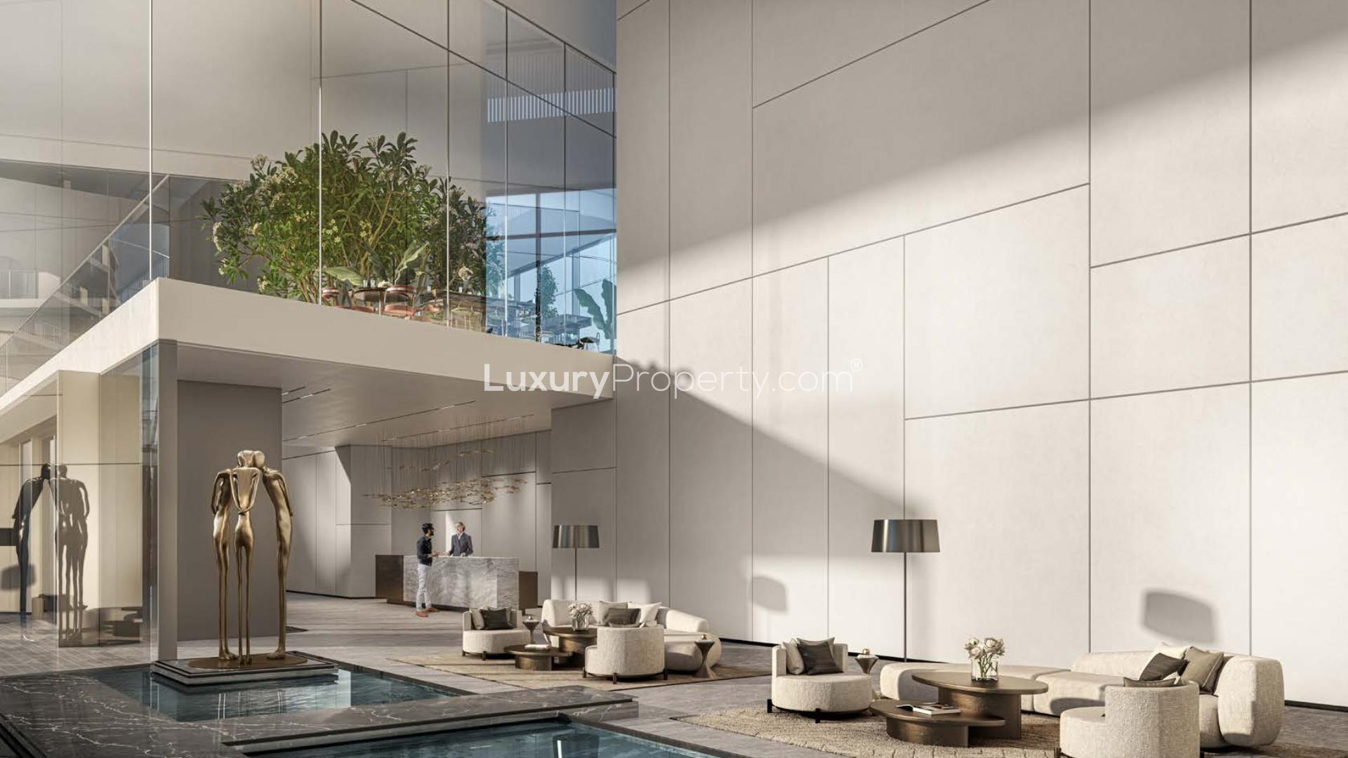Luxurious lobby at Louvre Abu Dhabi Residences, Saadiyat Island, featuring modern seating and sculpture
