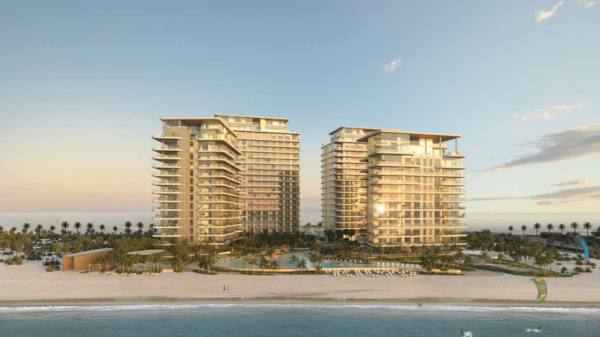 "Serenia Living beachfront apartments at sunset, Palm Jumeirah, Dubai for sale LP15691.","Serenia Living beachfront apartments, Palm Jumeirah, Dubai skyline view, luxury residential buildings.",Dubai beachfront apartment view from Serenia Living, overlooking ocean and pool area at sunrise