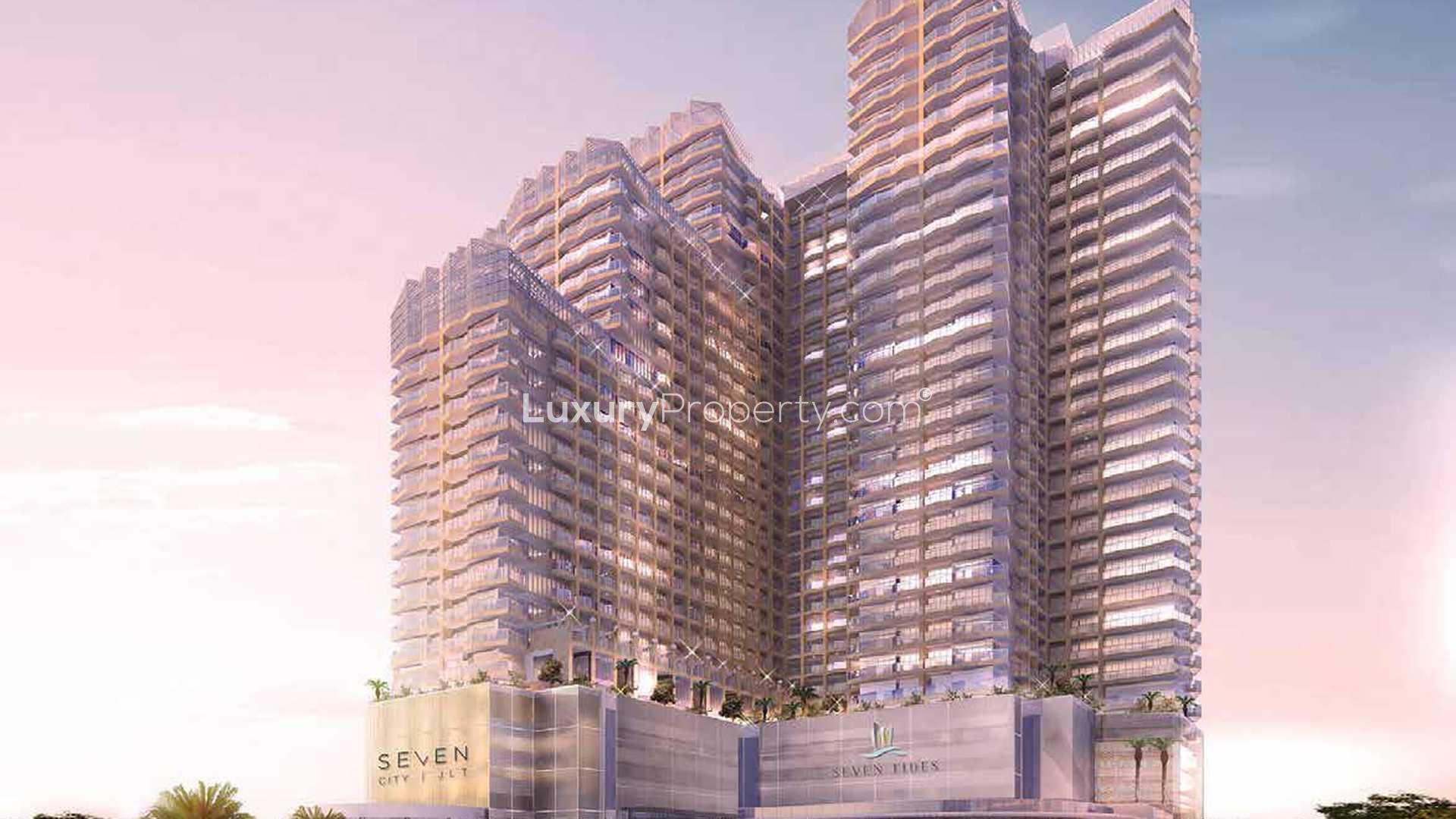 "Seven City JLT studio apartment building exterior in Jumeirah Lake Towers for sale.","Modern Se7en City JLT apartment development exterior in Jumeirah Lake Towers for sale.",Modern kitchen in Se7en City JLT studio apartment, Jumeirah Lake Towers, Dubai