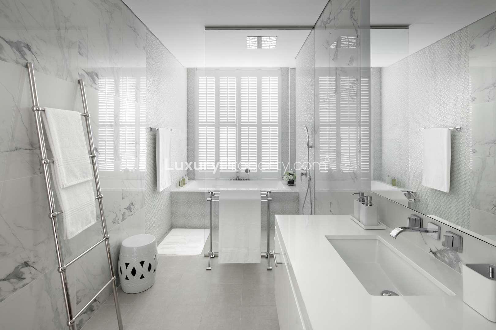 Studio apartment interior in Seventh Heaven, Al Barari, Dubai with modern furnishings and balcony view