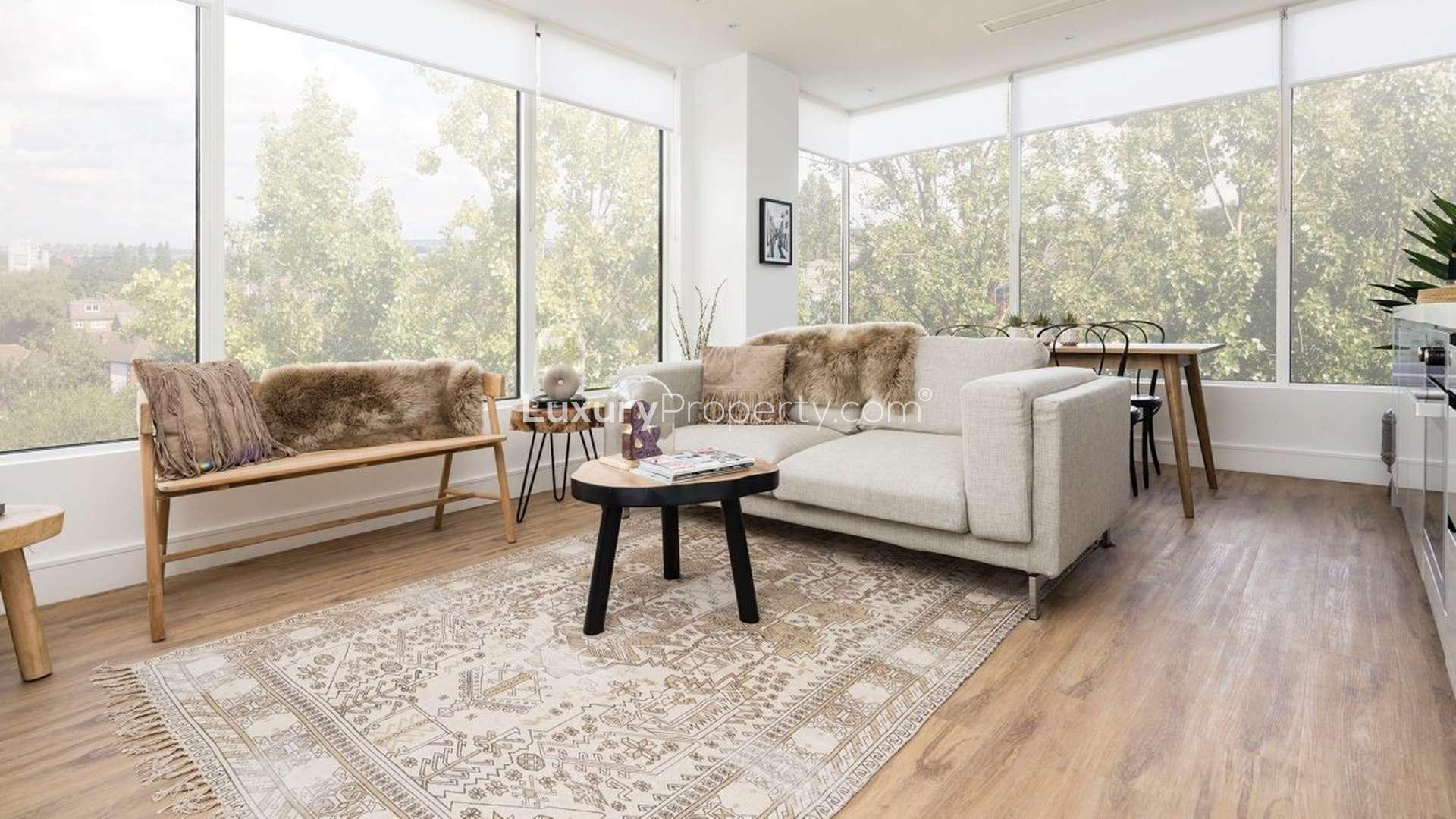 Luxury Westgate House apartments exterior in West London, surrounded by trees and parking area