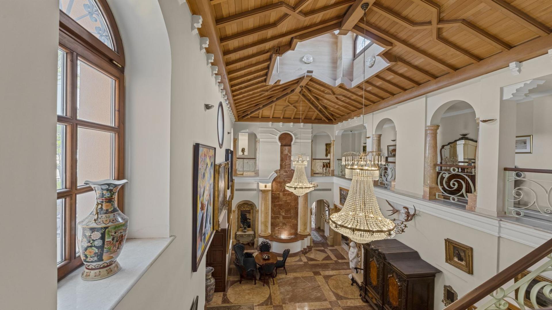 Luxurious marble-floored foyer with grand staircase in Nueva Andalucía villa, Marbella