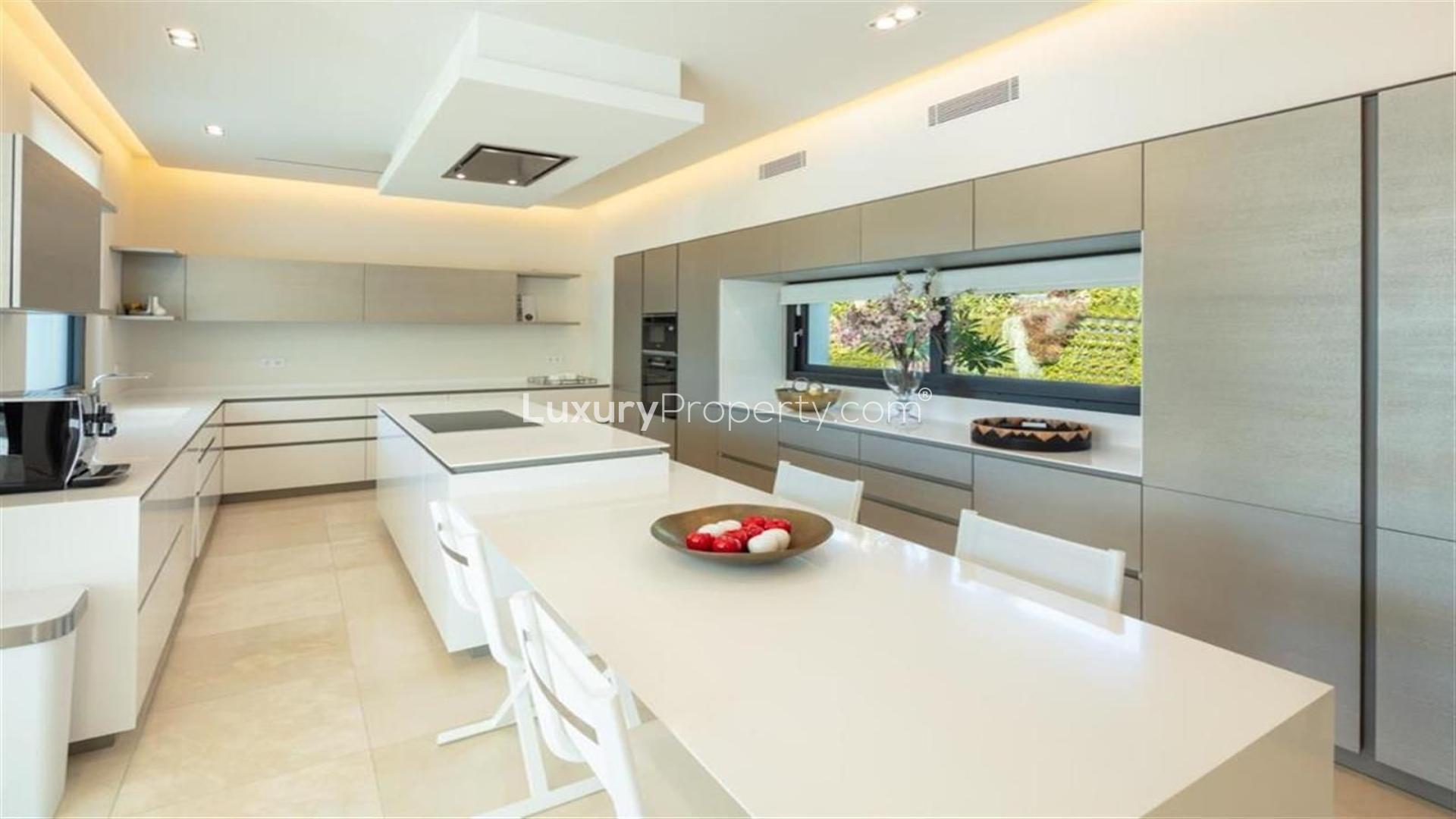 Luxury villa living room with pool view in Marbella Golf Valley, Nueva Andalucía