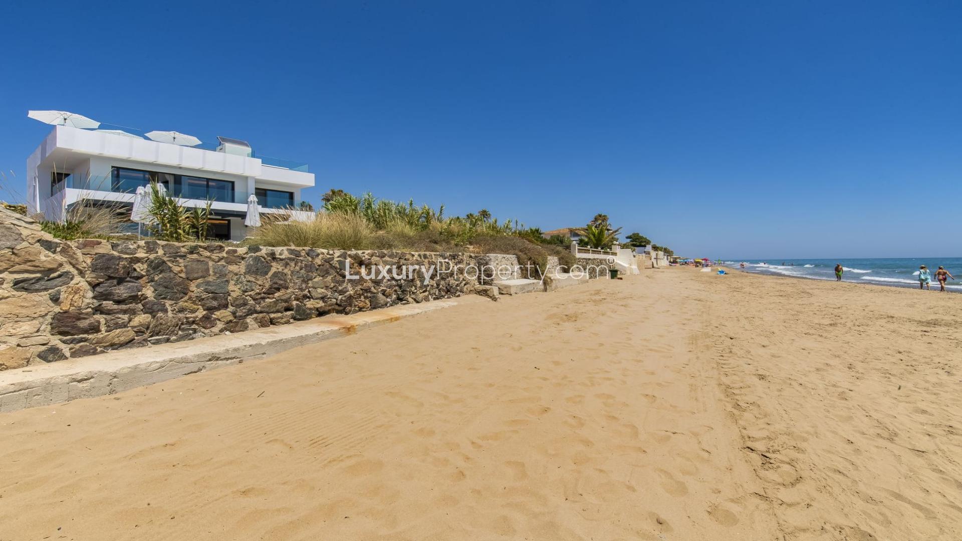 Aerial view of beachfront 6-bed villa in Costabella, Marbella with rooftop terrace