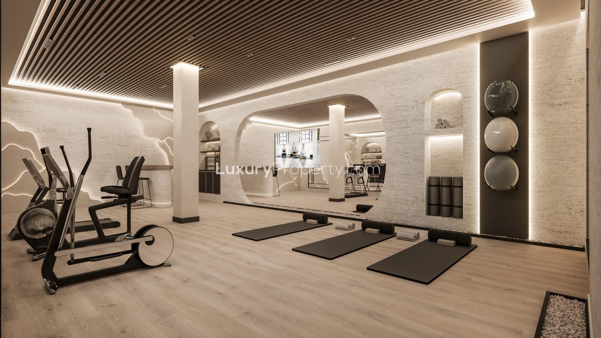 Luxurious Marbella villa garage with high-end cars, part of Golden Mile property for sale