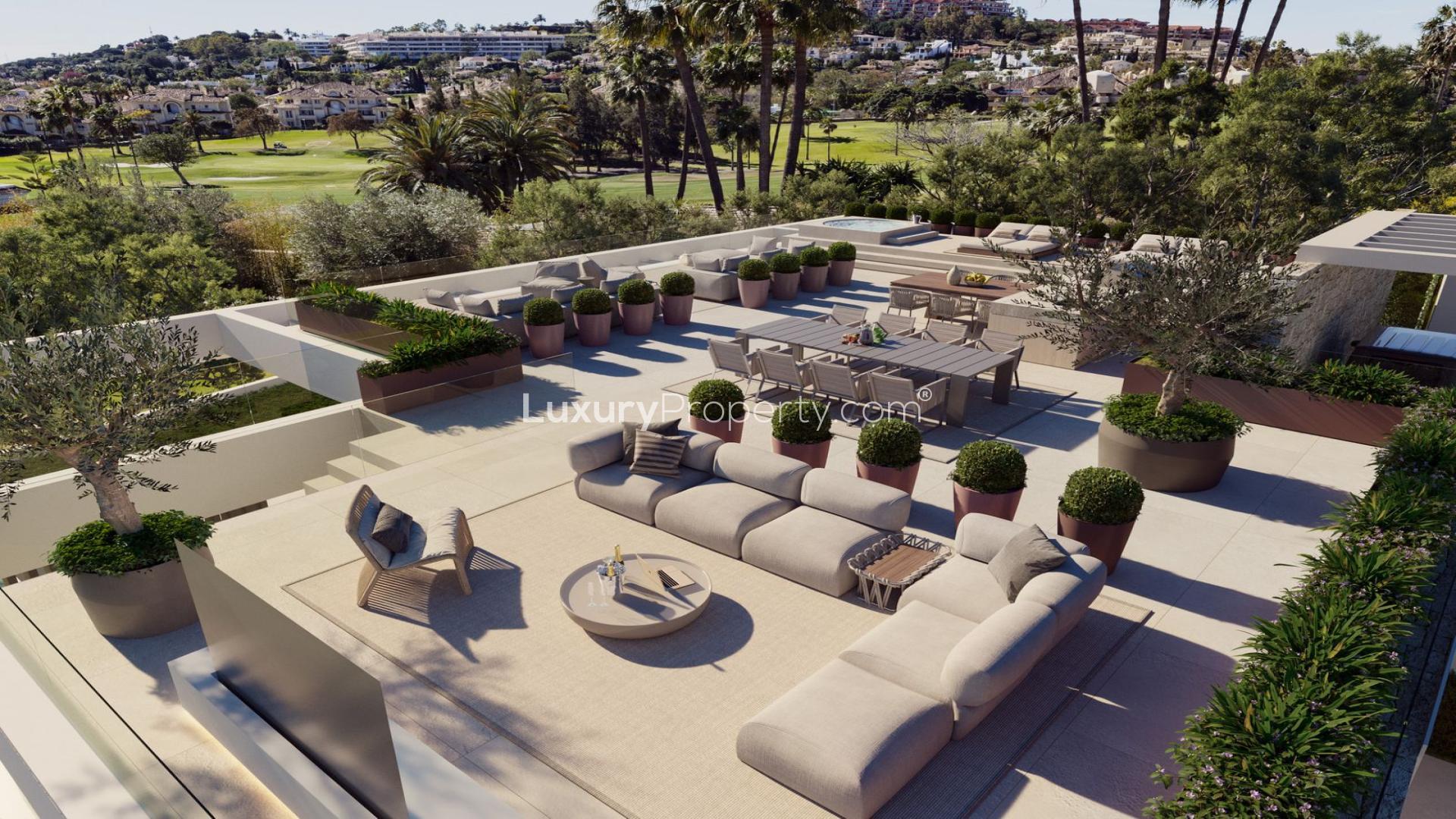 Modern detached villa with pool in Nueva Andalucía, Marbella, surrounded by lush greenery