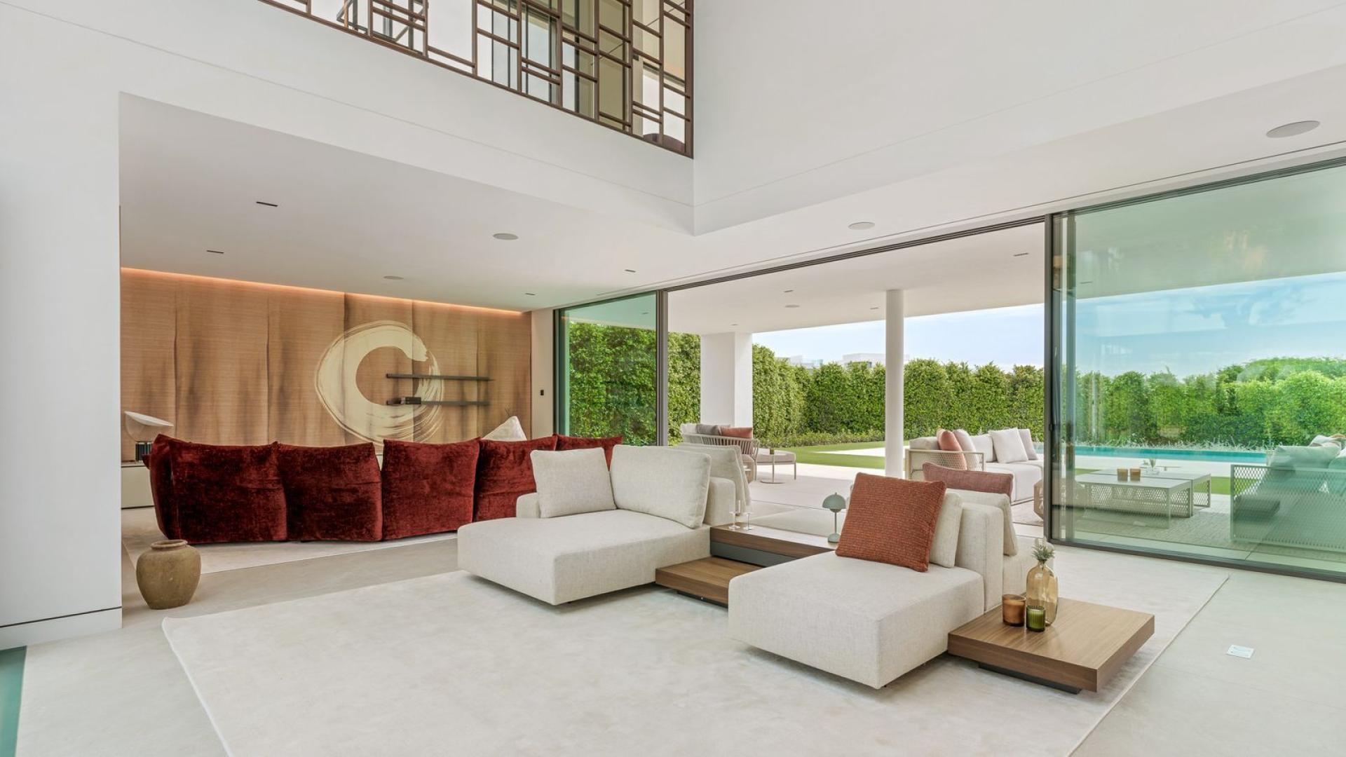 Outdoor terrace with dining area and pool in Marbella villa, The Golden Mile