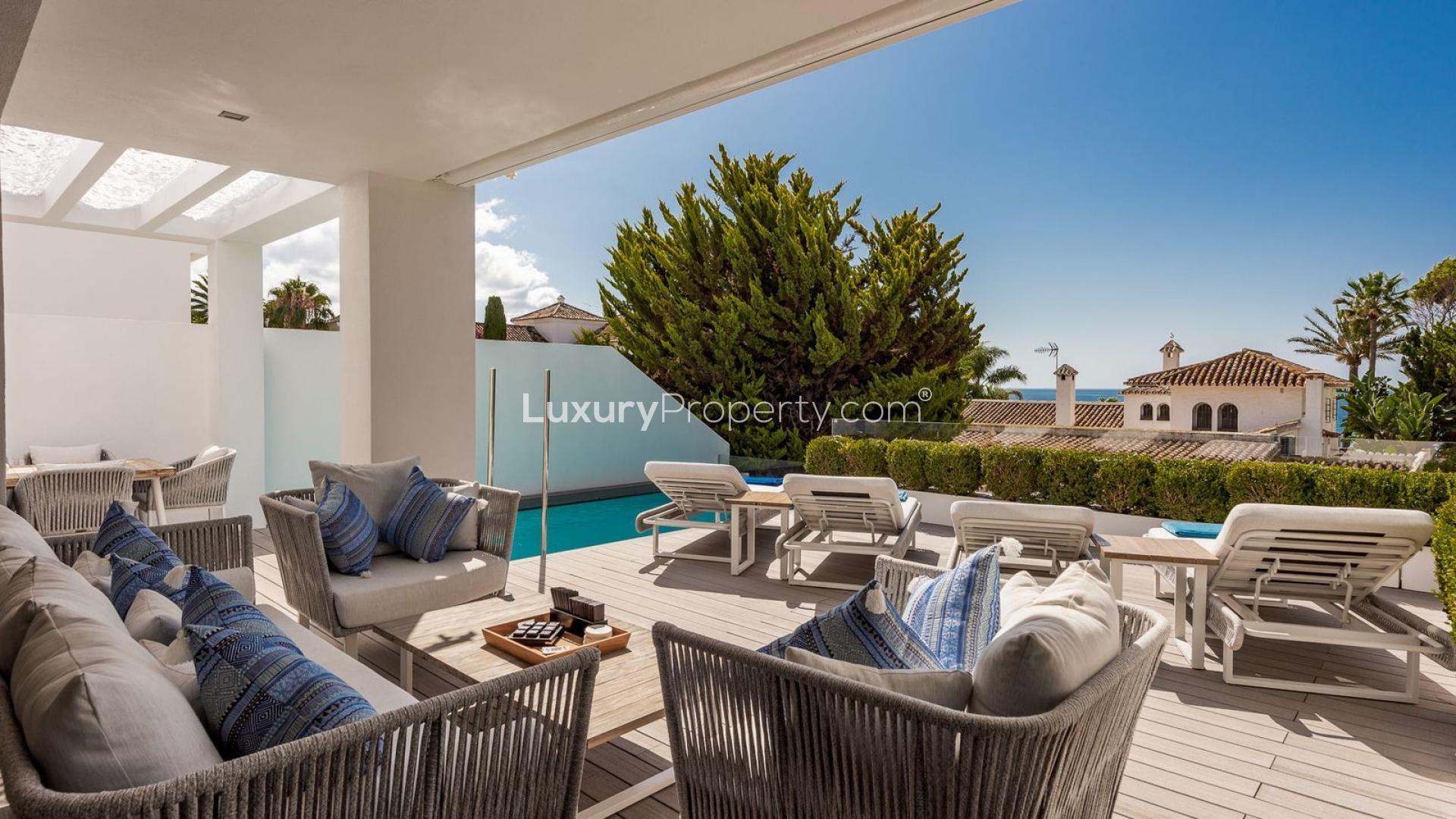 Luxurious poolside view at 4-bedroom villa in Puente Romano, Marbella, Golden Mile