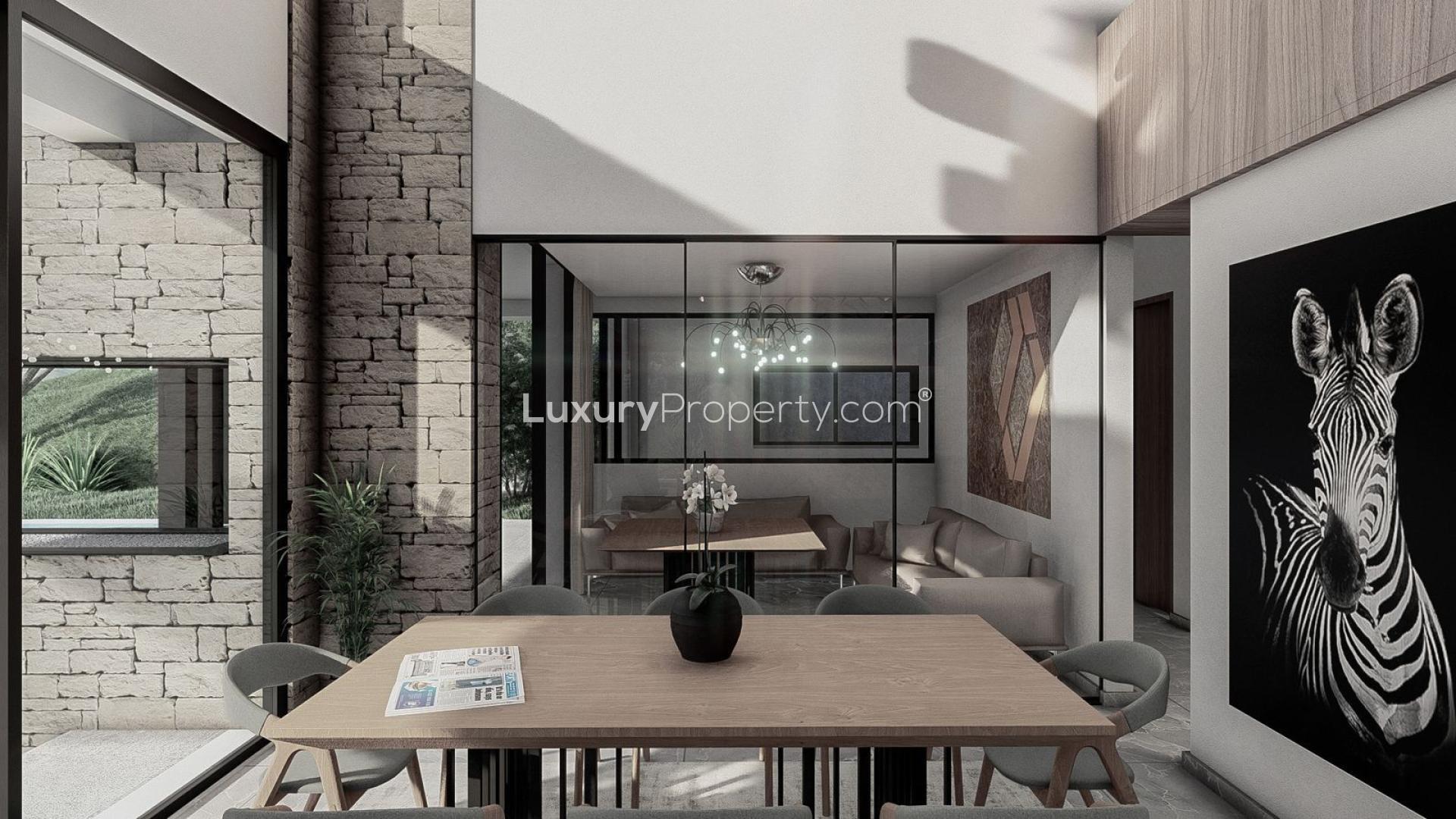 Modern dining area in luxury villa, La Alquería, Málaga, with stylish décor and fireplace