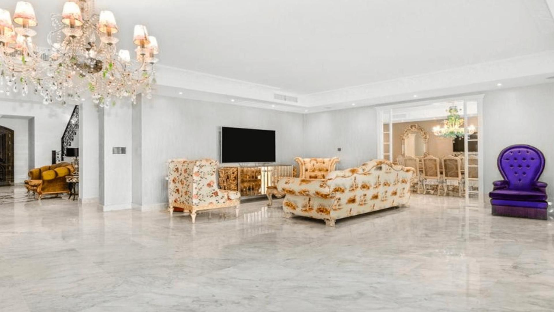 Luxurious bedroom in 8-bed villa, Cascada Camoján, Marbella with elegant decor and chandelier