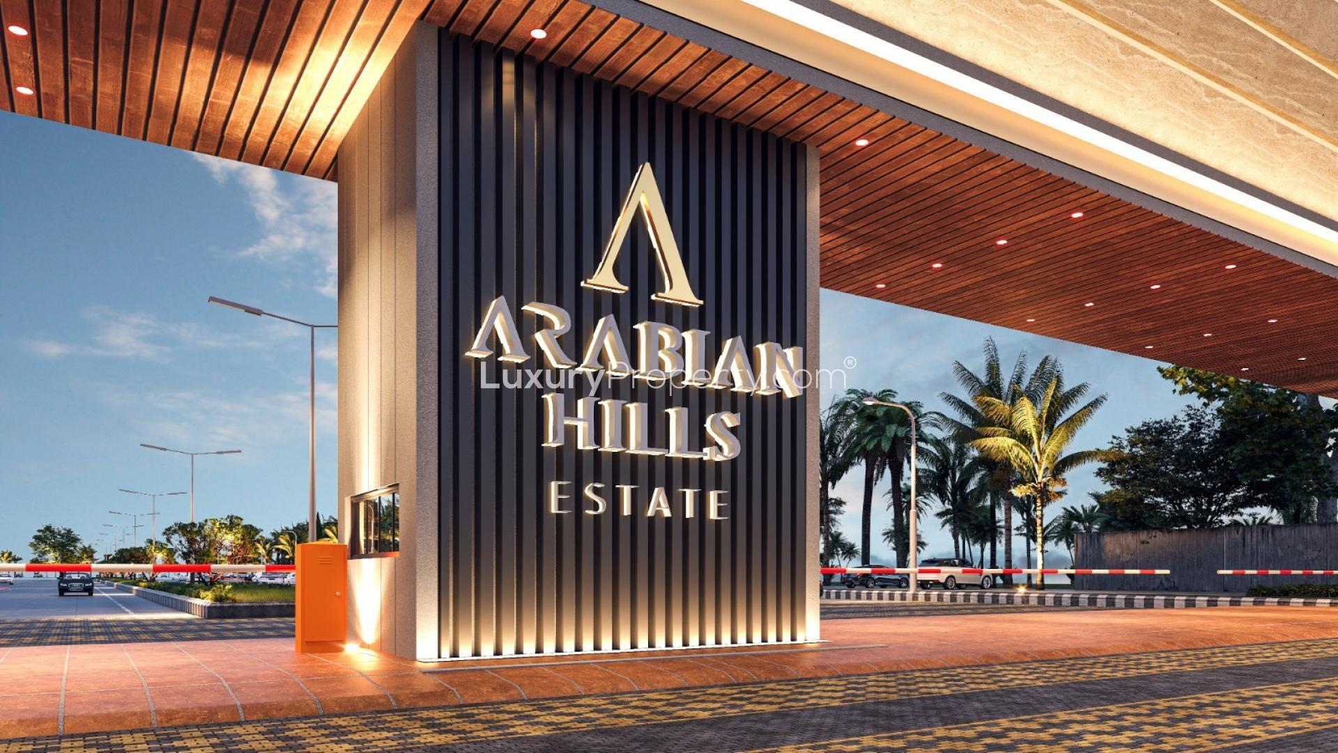 Prime villa plot with waterfront view in Arabian Hills Estate, featuring lush surroundings