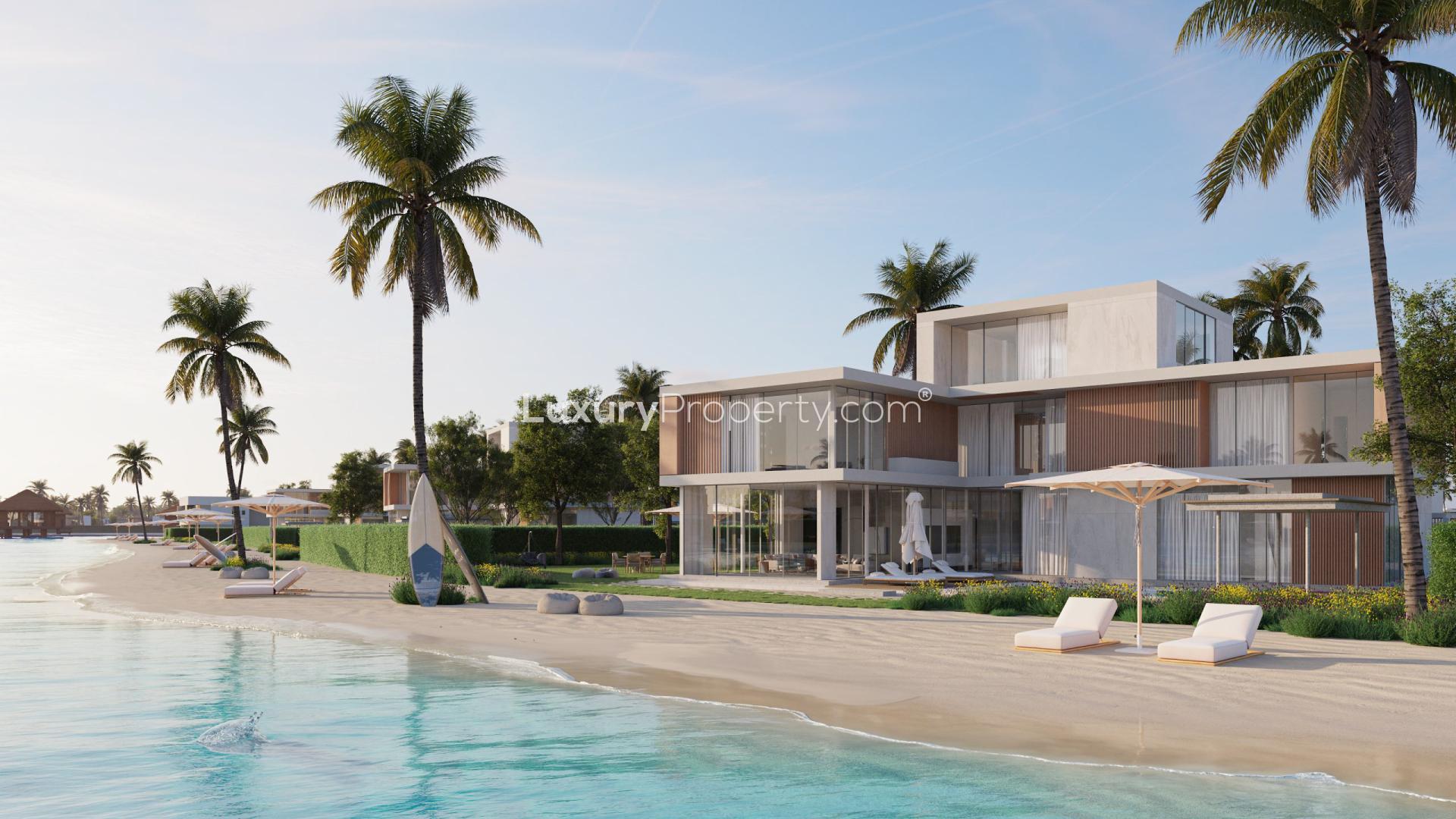 Luxurious beachfront land in Arabian Hills Estate with palm trees and modern villas
