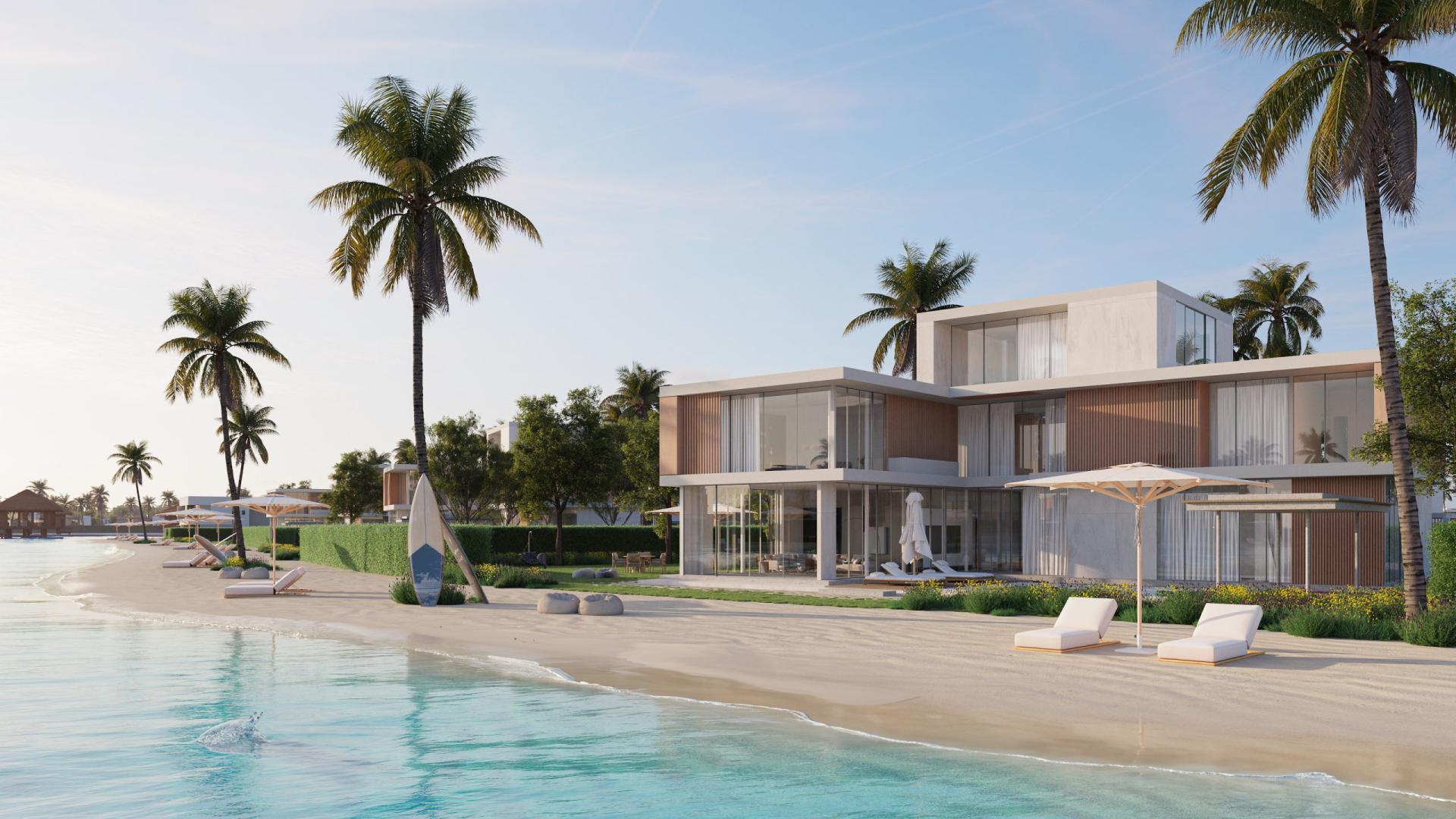 Luxurious beachfront land in Arabian Hills Estate with palm trees and modern villas
