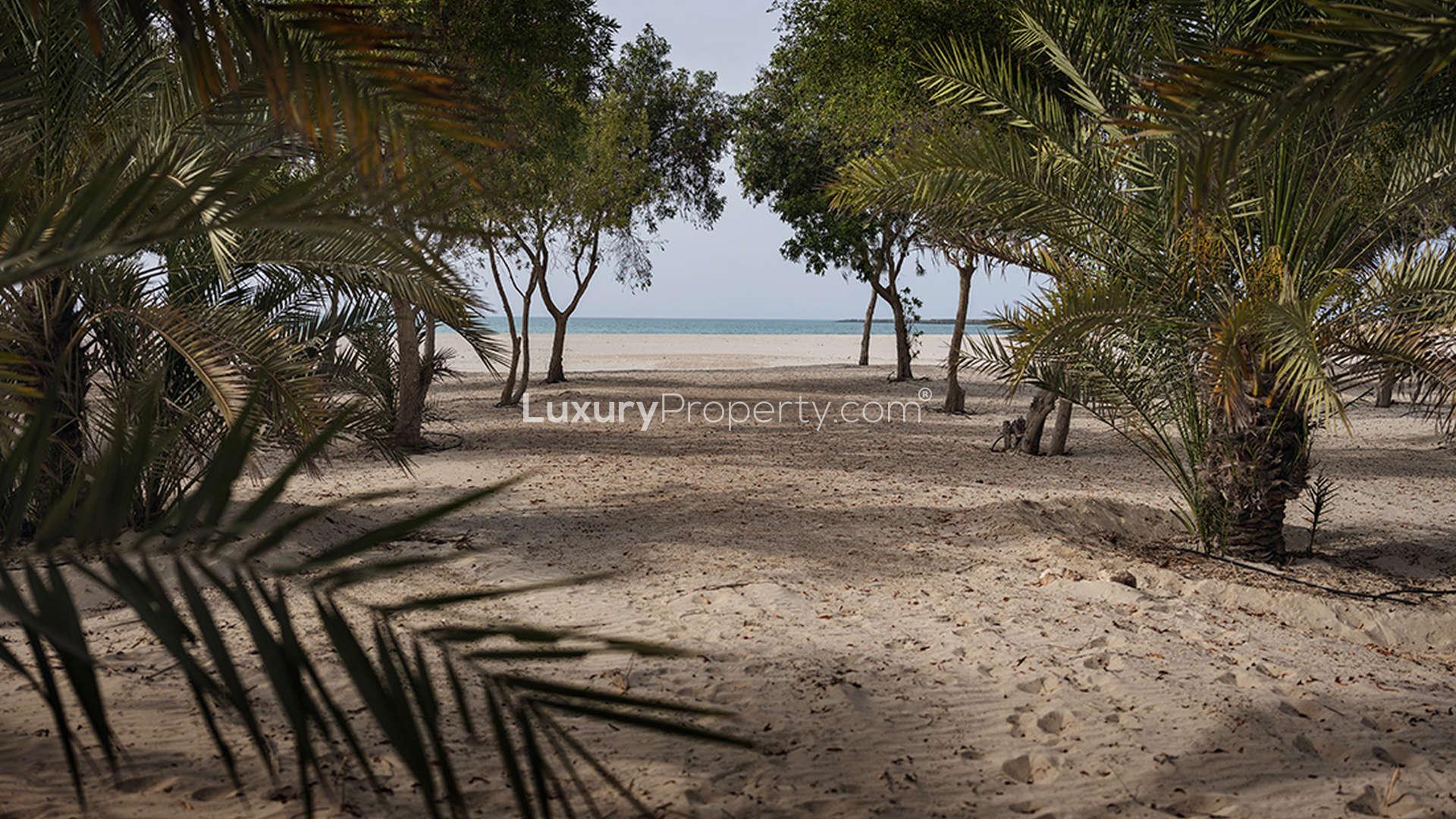 Tree-lined pathway in Al Jurf Gardens, Boutique Style community, villa plot for sale