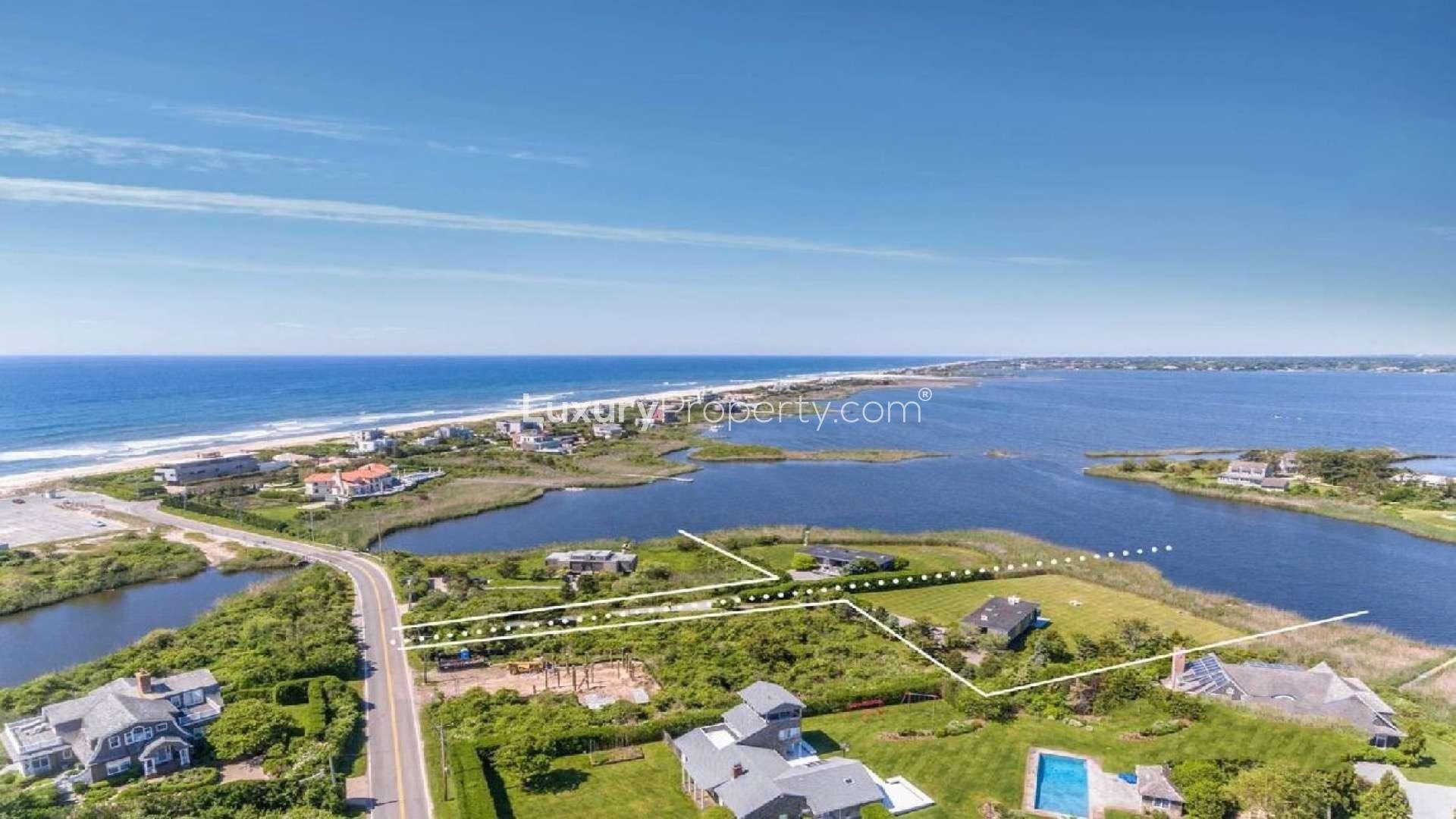 Double waterfront plot in Bridgehampton, New York, with lush greenery and ocean views