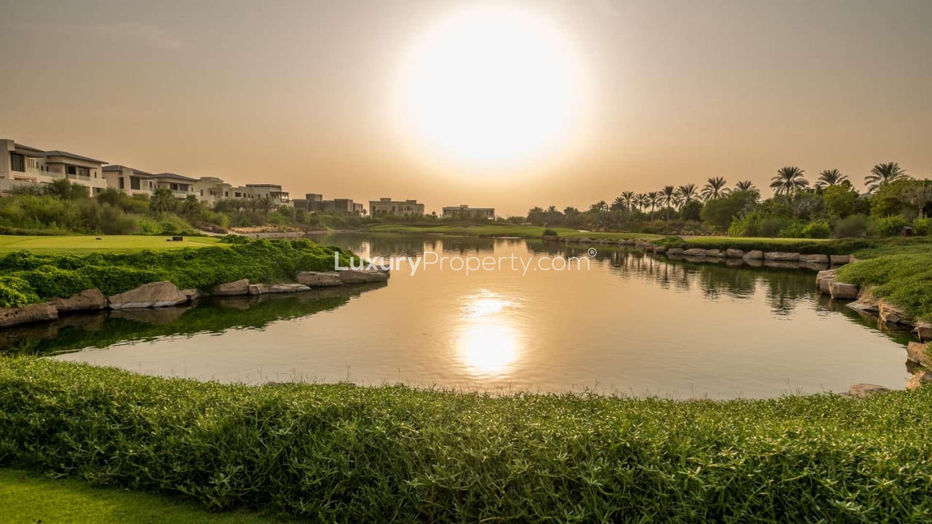 Dubai Hills Estate plot view with skyline, lush greenery, and golf course in Emerald Hills