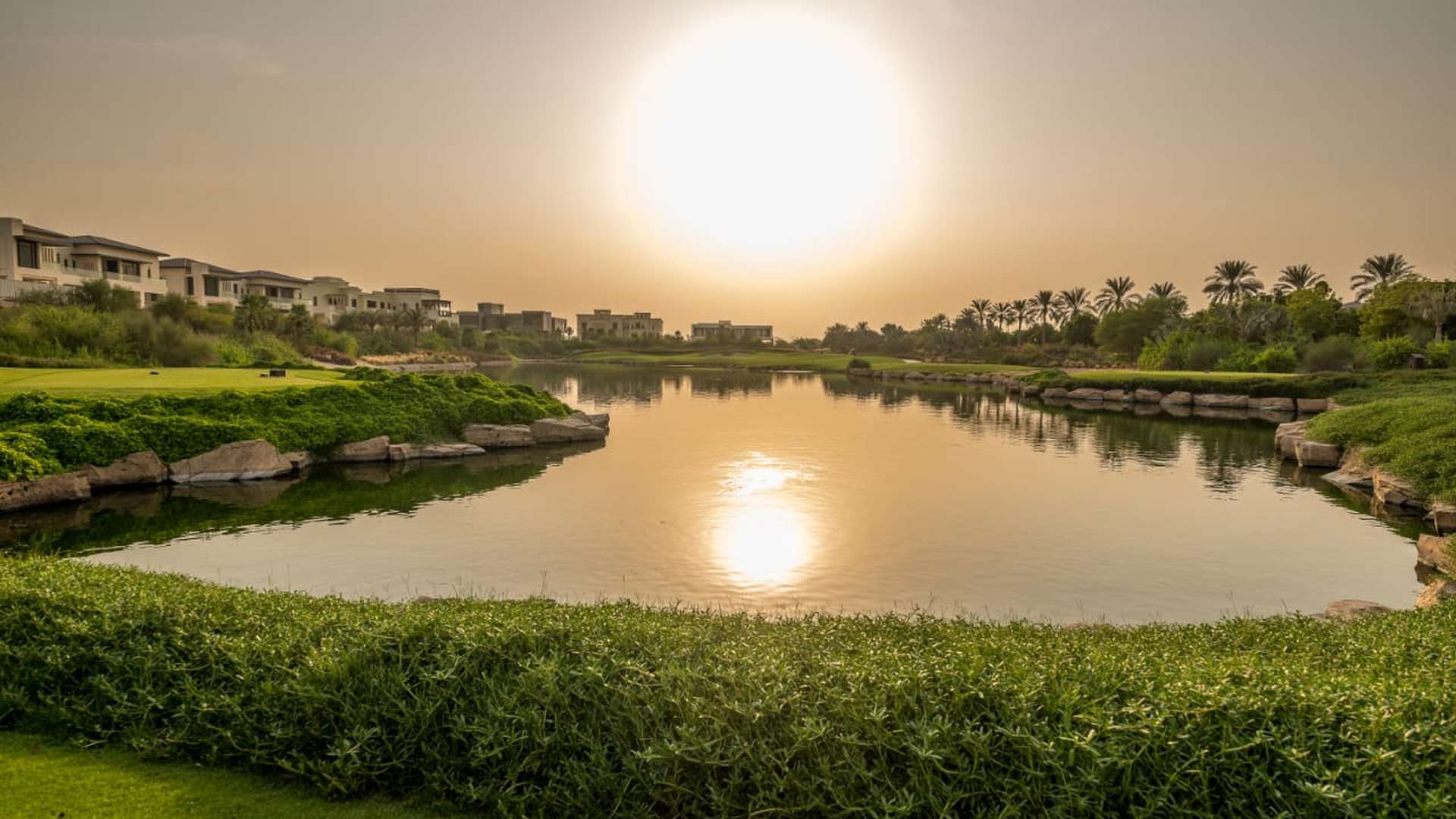 Prime residential plot view in Emerald Hills, Dubai Hills Estate, at sunset