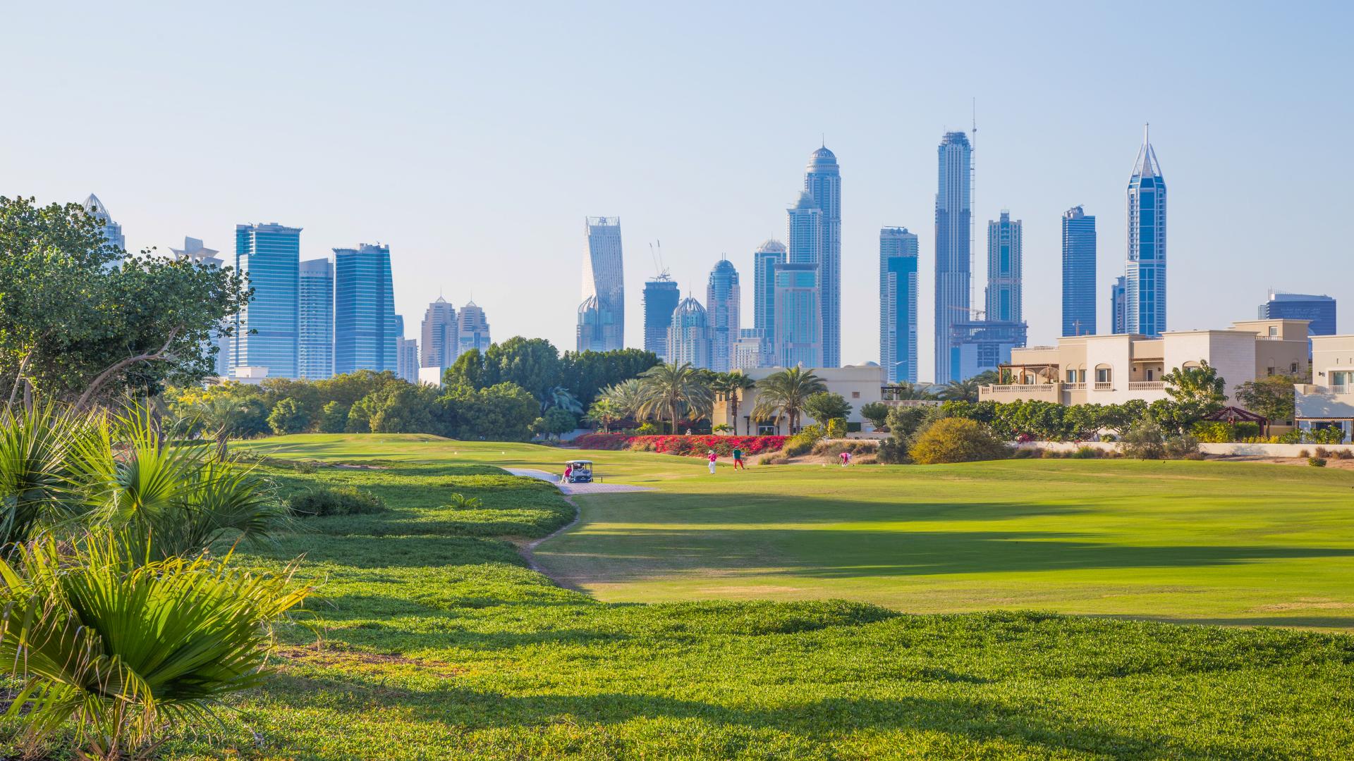 Lakefront view of Emirates Hills residential plots for sale, ideal for luxury home construction