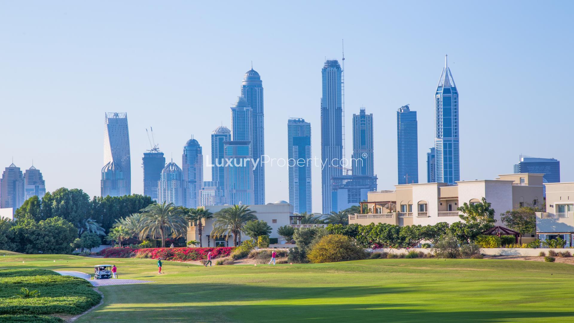 Plot for sale in Emirates Hills with skyline view and lush greenery