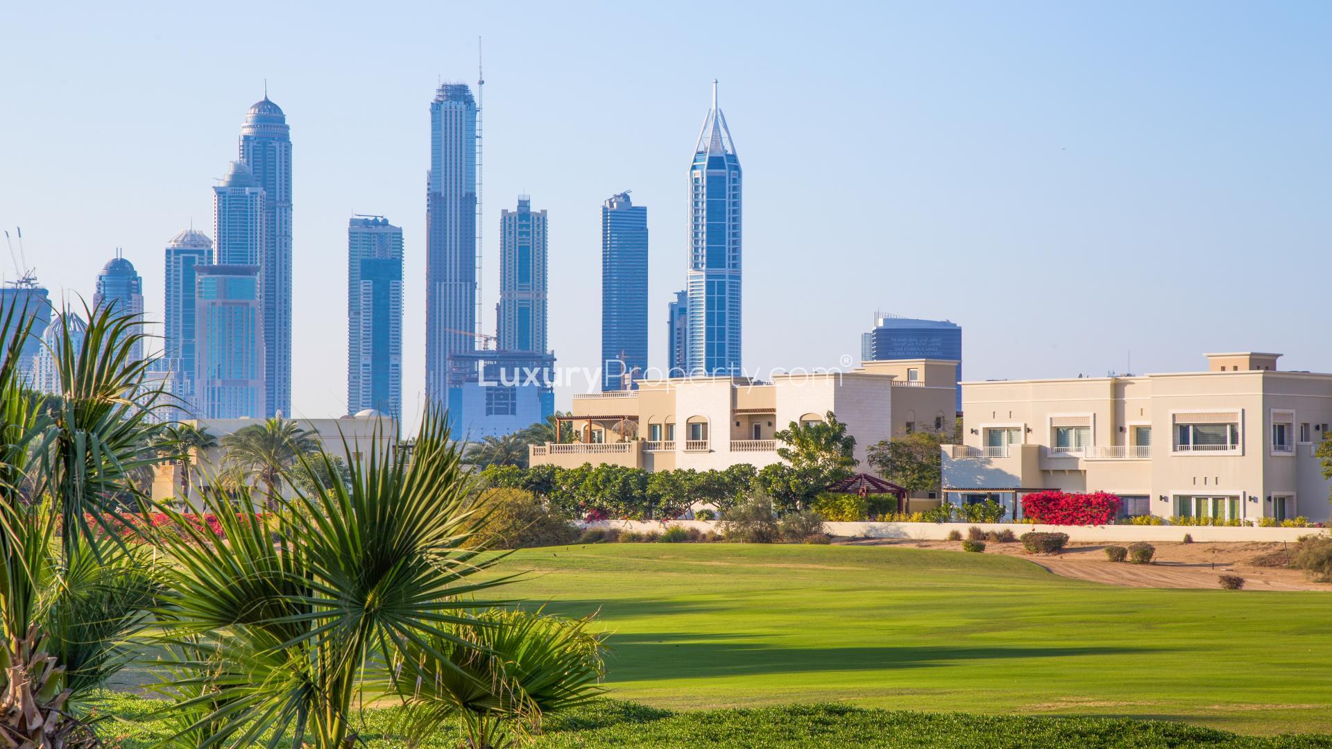 Plot for sale in Emirates Hills with city skyline view, perfect for dream home build