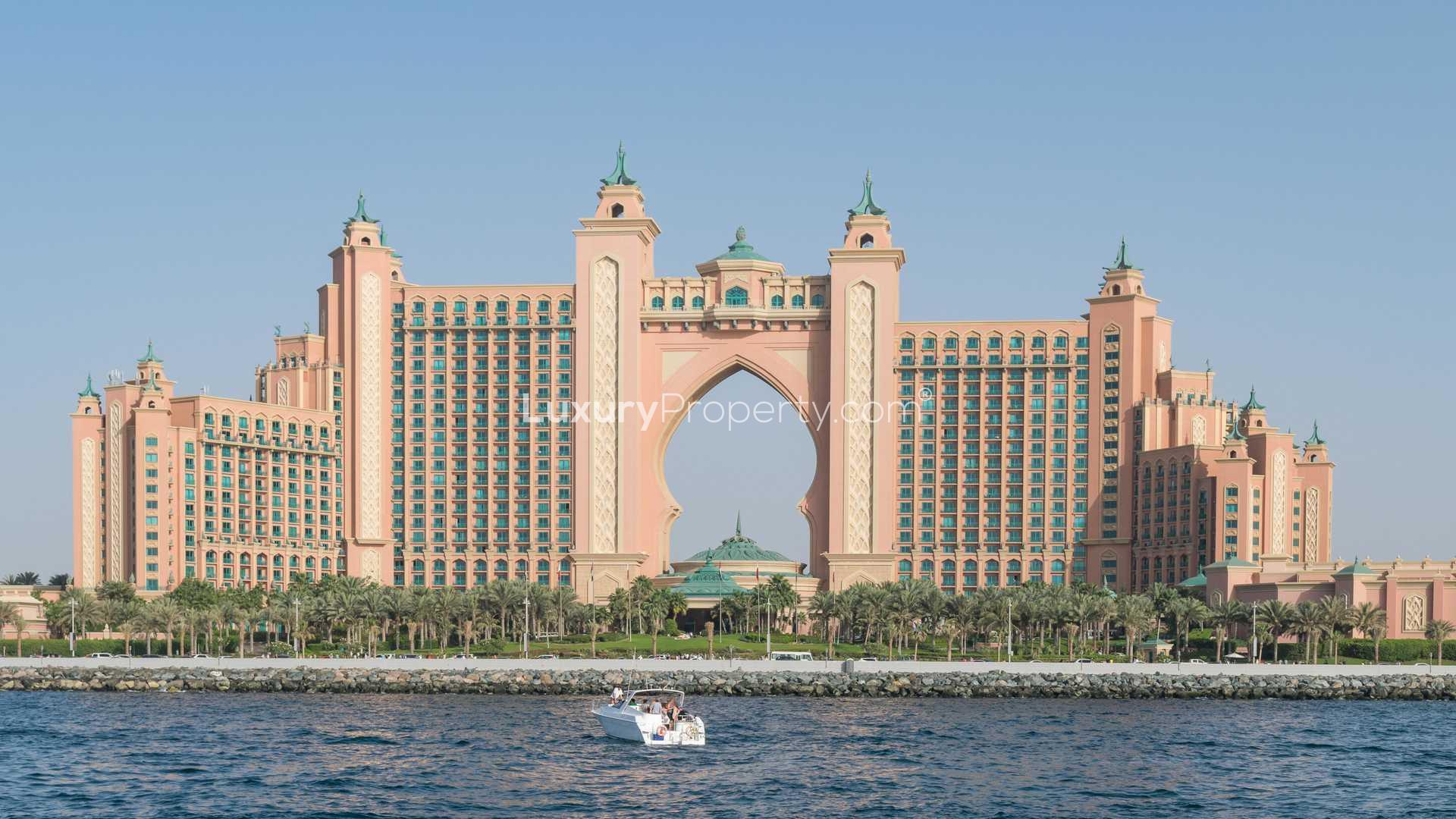 Exclusive waterfront villa plot view on Frond, Palm Jumeirah with palm trees and walkway