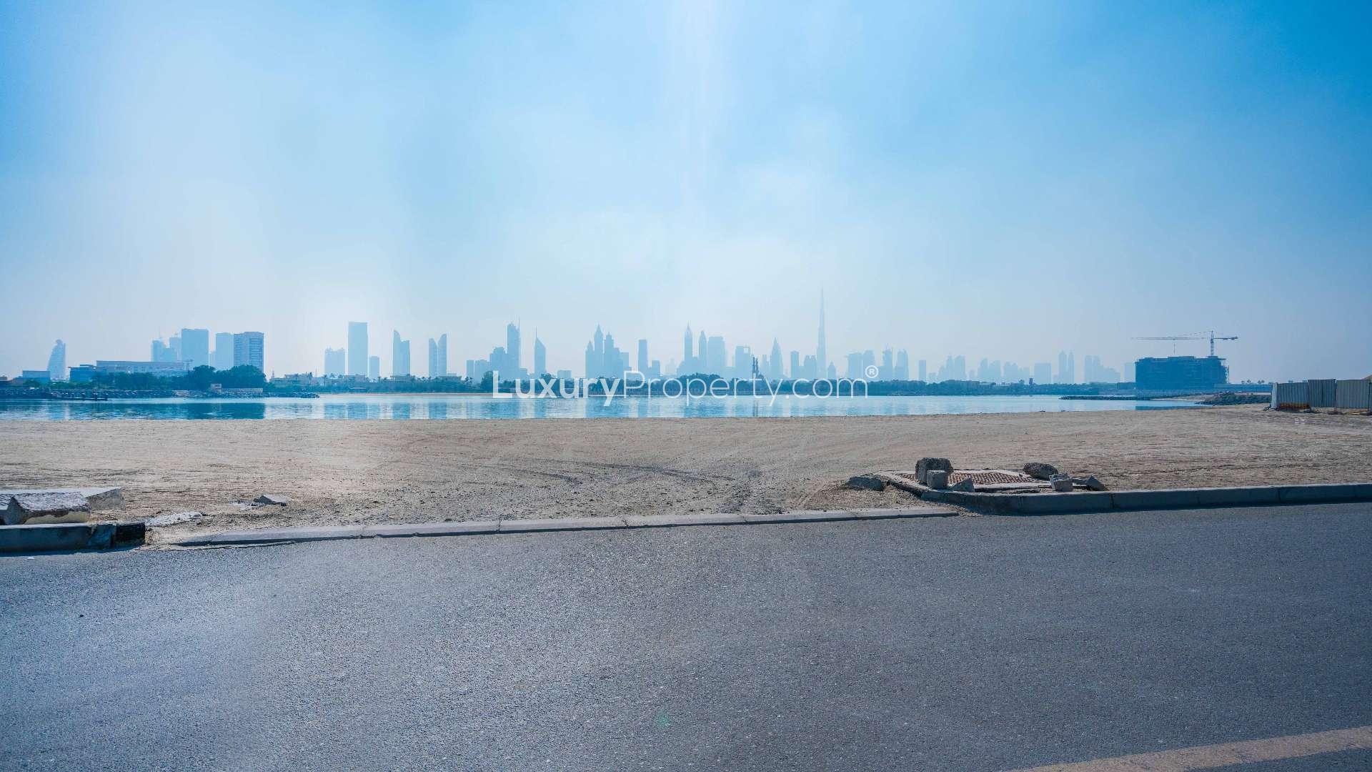 Alt text: "Pearl Jumeirah land plot near Nikki Beach Resort, ideal for residential development.",Exquisite land plot view on Pearl Jumeirah with city skyline near Nikki Beach Resort