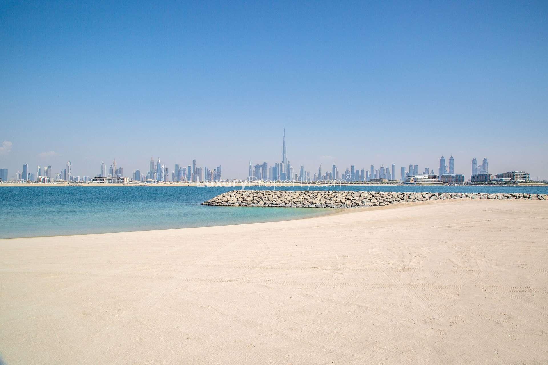 Beachfront view of Dubai skyline from Jumeirah Bay Island, ideal for residential masterpiece