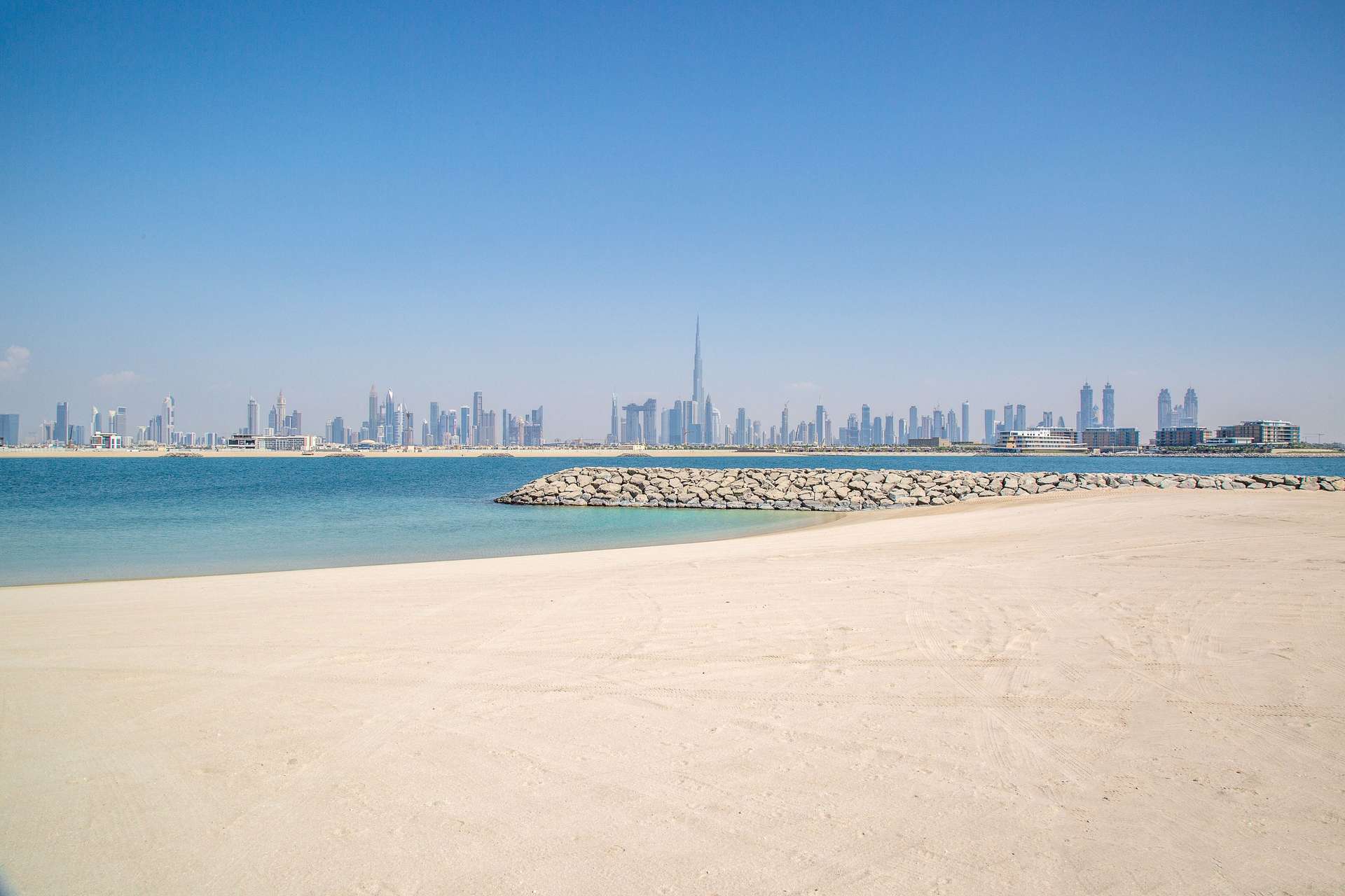 Beachfront view of Dubai skyline from Jumeirah Bay Island, ideal for residential masterpiece