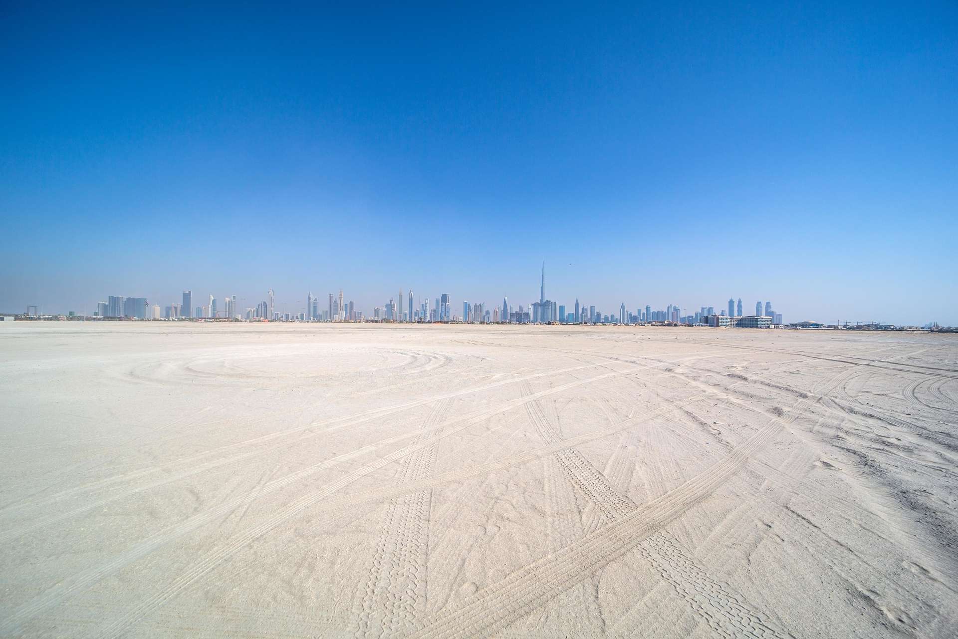 "24,000 Sq Ft plot on Jumeirah Bay Island with stunning city skyline view.","Stunning waterfront view of Dubai skyline from Jumeirah Bay Island plot for sale."