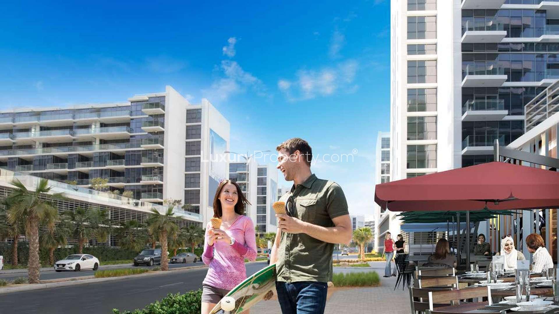 Modern high-rise apartment building at Radisson Dubai DAMAC Hills in Dubailand at night